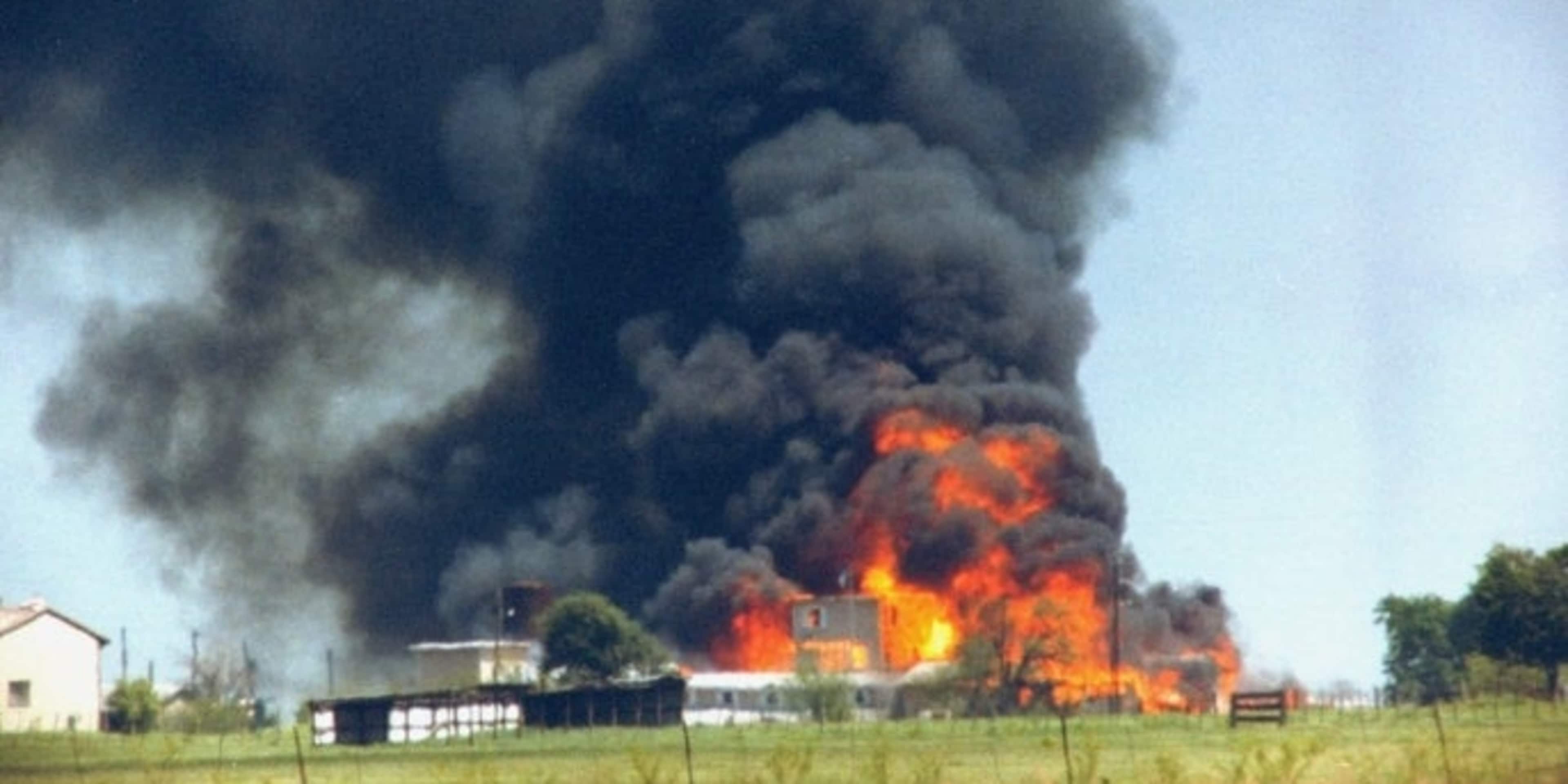 Fire and smoke consuming the David Koresh-led Branch Davidian cult compound, 1993.  (Credit: Mark Perlstein/The LIFE Images Collection/Getty Images)