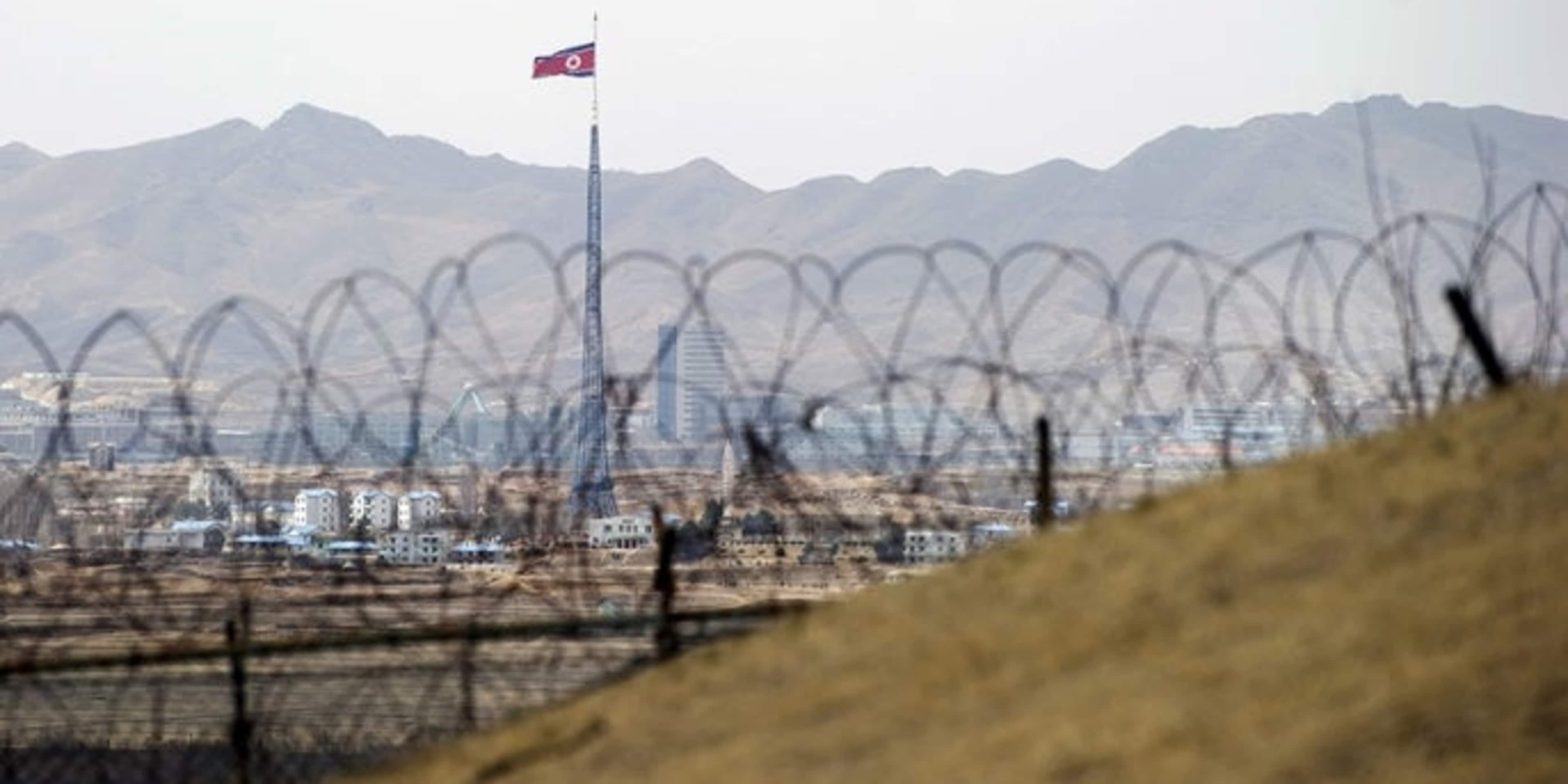 North Korea's propaganda village of Gijeongdong as seen through barbed wire from the the Joint Security Area of the Demilitarized Zone on the border between North and South Korea. (Credit: Saul Loeb/AFP/Getty Images)