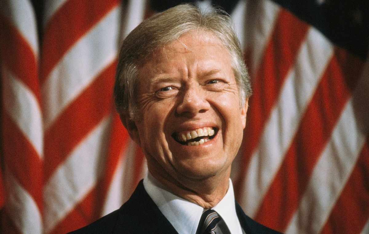 U.S. President Jimmy Carter smiles broadly as he attends a town hall meeting held at North High School, Torrance, California, September 22, 1980. (Photo by Diana Walker/Getty Images)