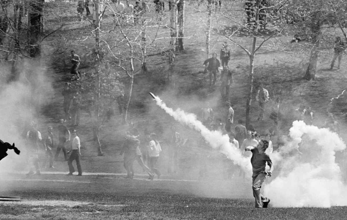As others call for help, teenager Mary Ann Vecchio (center) kneels beside the body of Kent State University student Jeffrey Miller (1950 - 1970) who had been shot during an anti-war demonstration on the university campus, Kent, Ohio, May 4, 1970.
