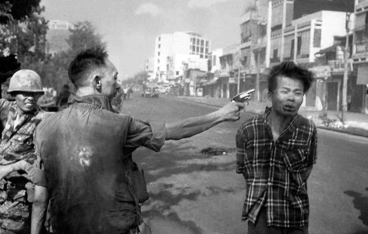 In this Feb. 1, 1968, file photo, South Vietnamese Gen. Nguyen Ngoc Loan, chief of the National Police, fires his pistol into the head of suspected Viet Cong officer Nguyen Van Lem (also known as Bay Lop) on a Saigon street