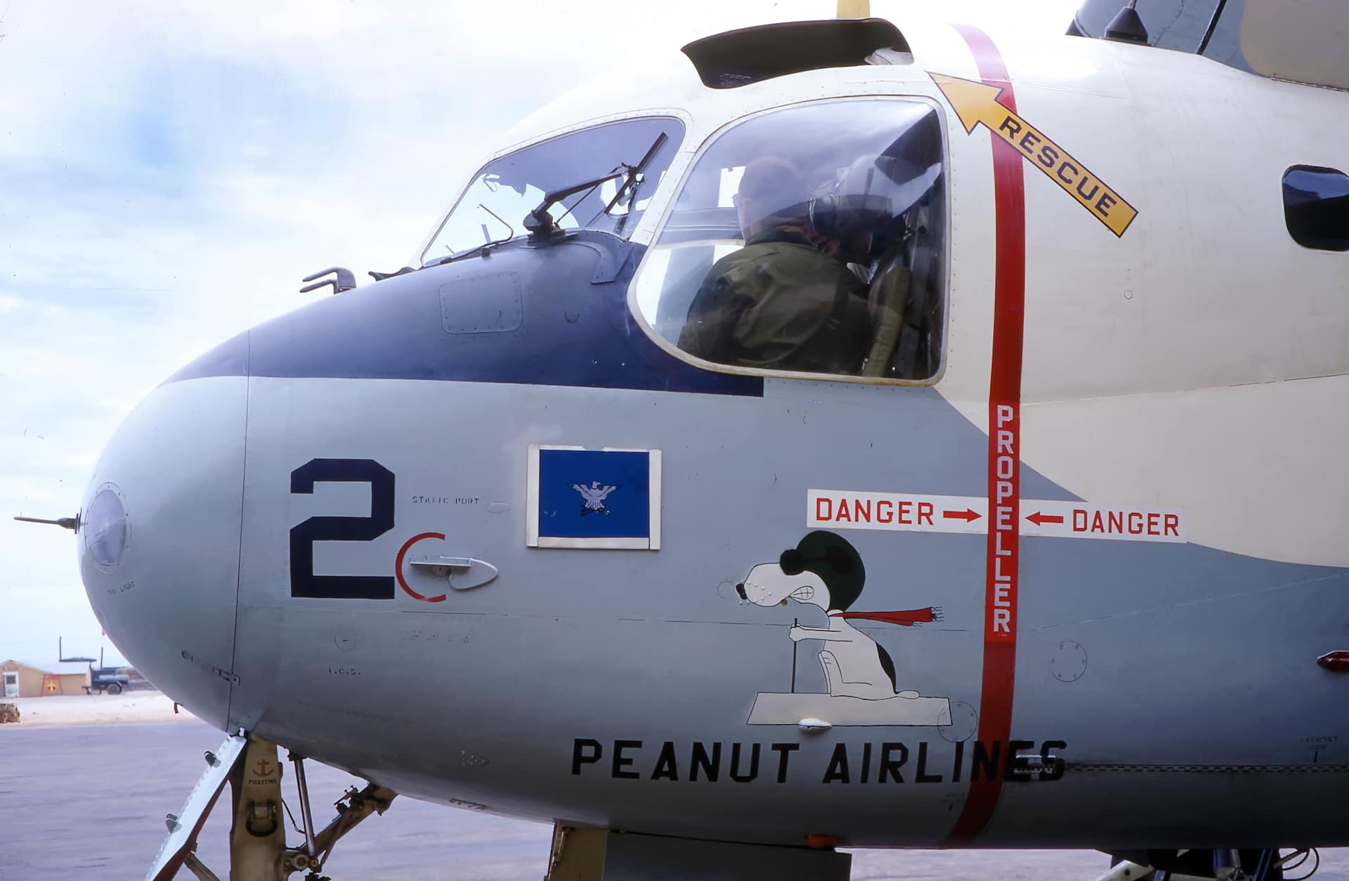 A Navy Grumman C-1 Trader carrier-based airplane with "Snoopy" nose art, photographed at the Phu Bai Airport, Quang Tri Province, Vietnam, June 30, 1967.