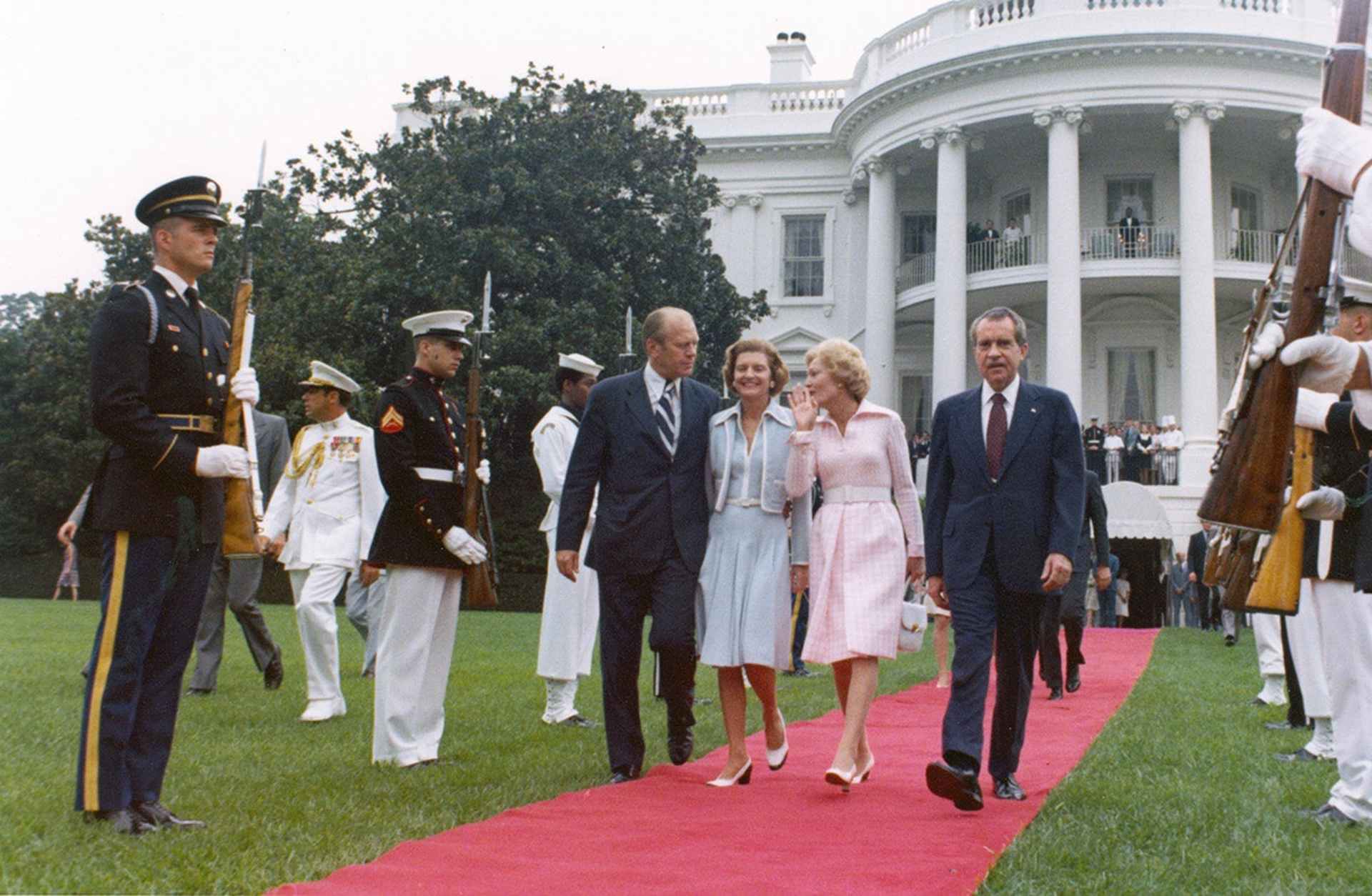 The Fords with the Nixons, as they depart the White House in disgrace.