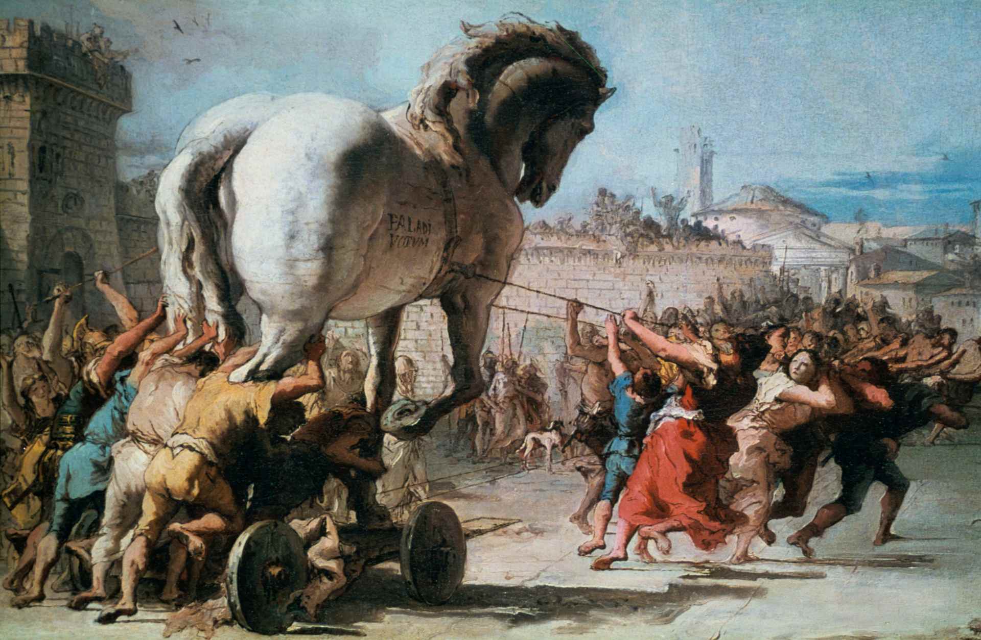 colorful painting of a large horse on wheels being pulled down a road