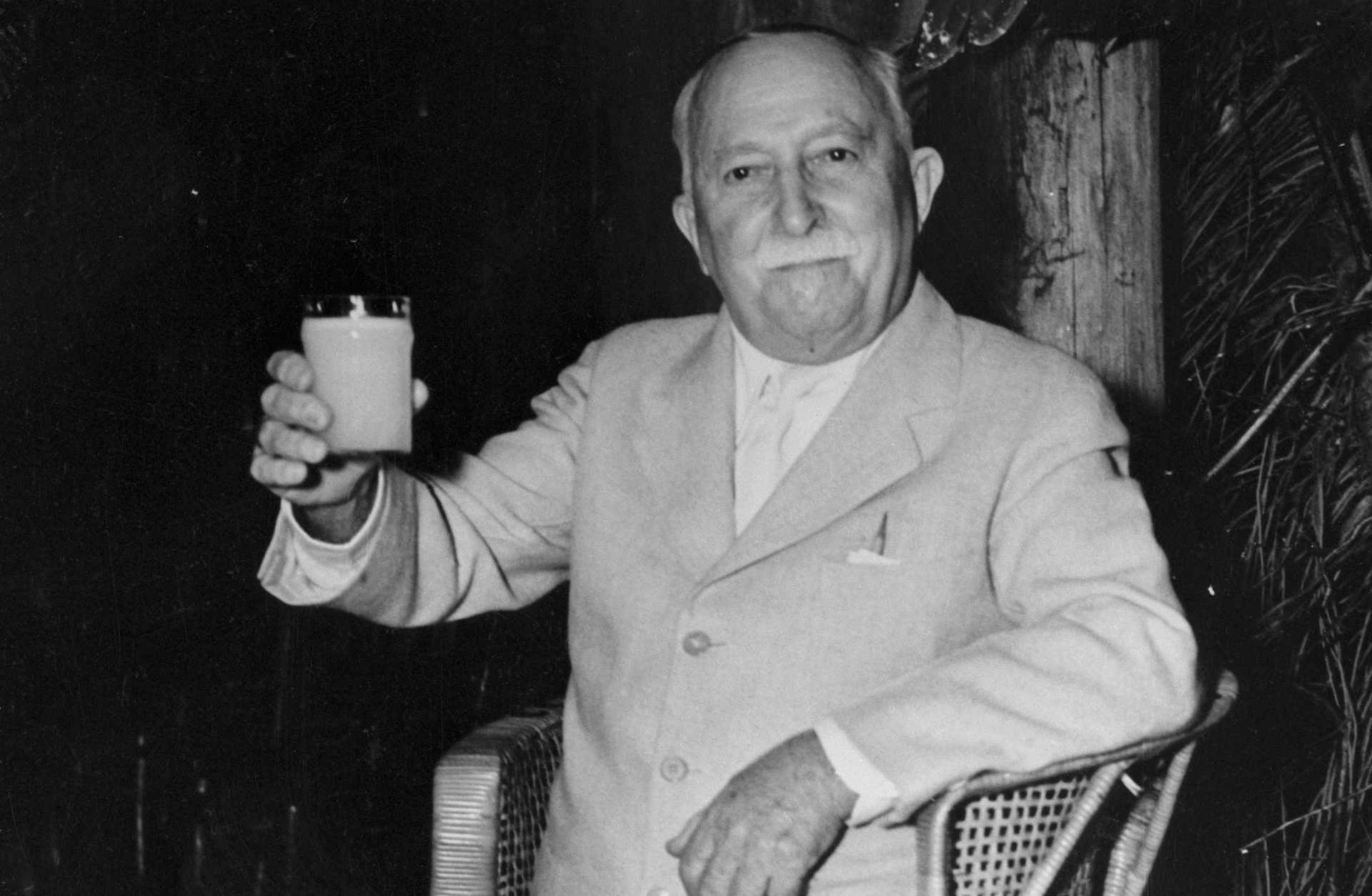 John Harvey Kellogg Sitting and Holding Glass