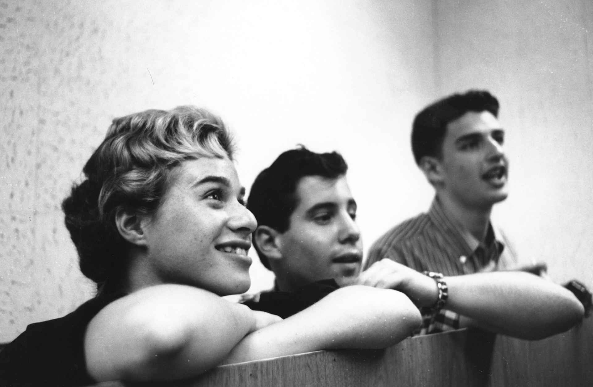 Singer Songwriters Carole King, Paul Simon and Gerry Goffin listening during a recording session.