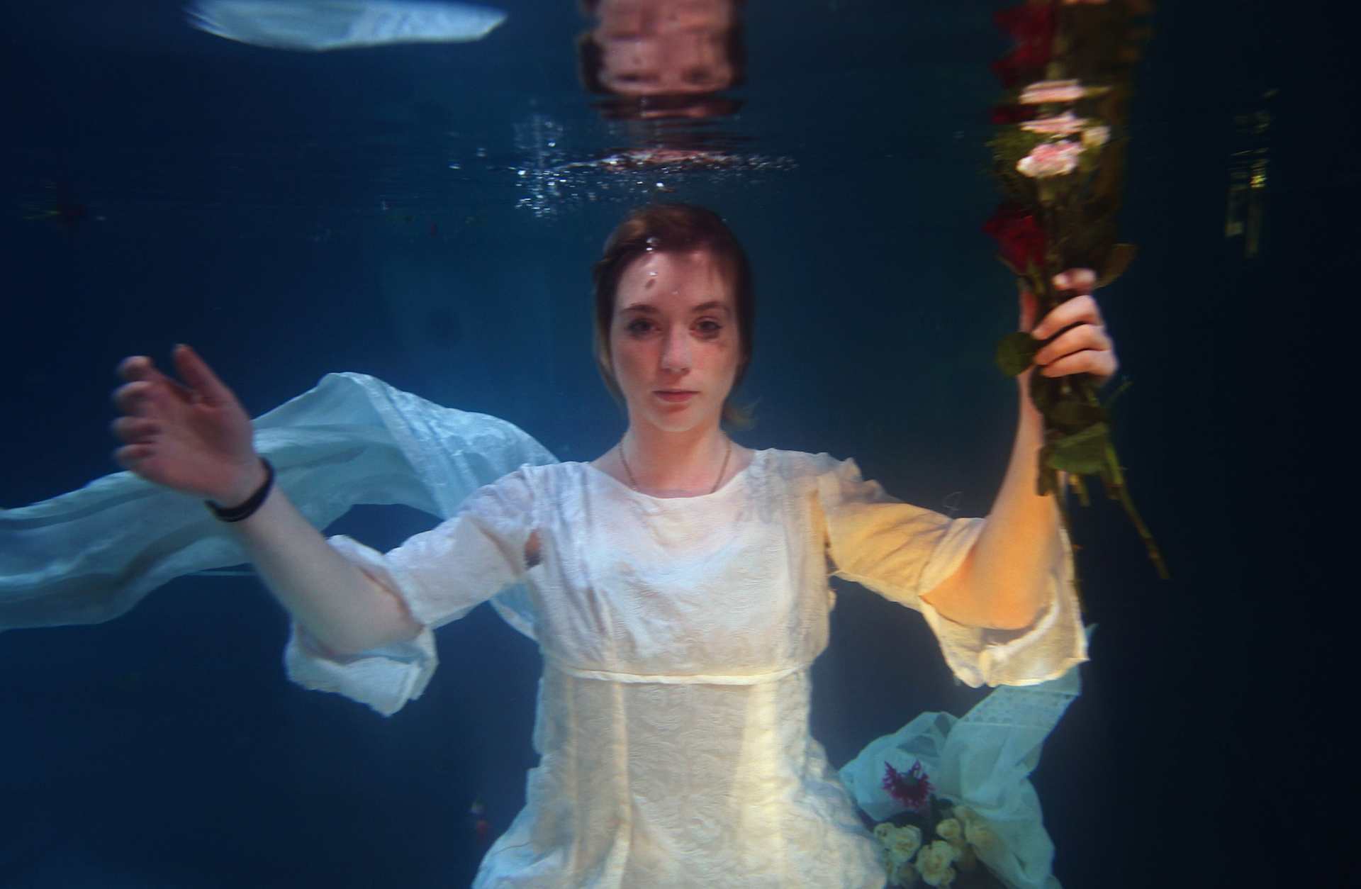 Helen Morton of the Three Bugs Fringe Theatre company performs 'Ophelia drowning' in the Apex Hotel swimming pool during the 2009 Edinburgh Festival Fringe on August 11, 2009. The play is inspired by Sir John Everett Millais' 1852 painting entitled 'Ophelia,' depicting the character from Shakespeare's play 'Hamlet.'