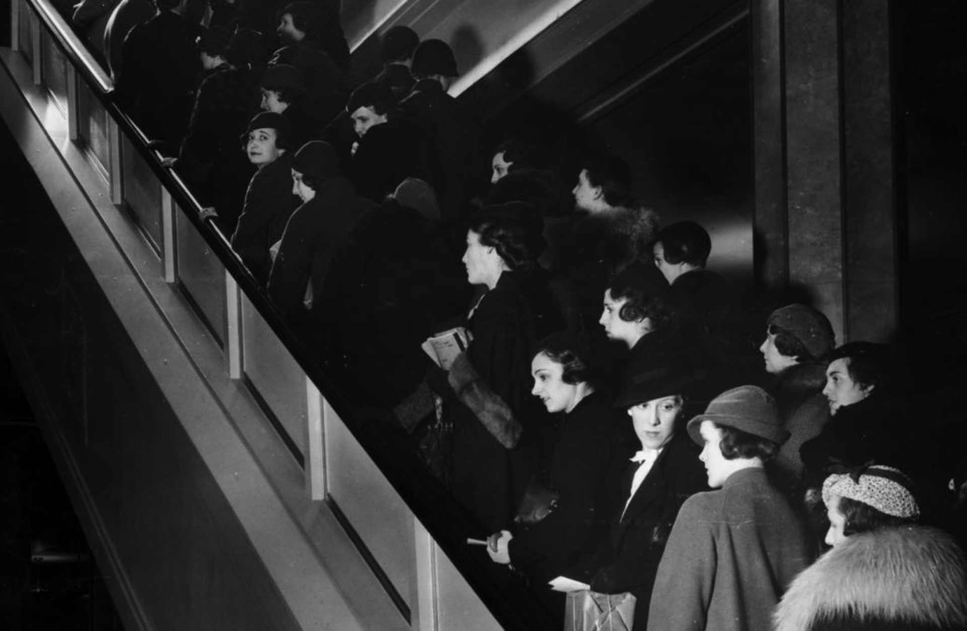 A crowd of shoppers on an escalator inside a department store in New York City, 1935. (Credit: Hulton Archive/Getty Images)