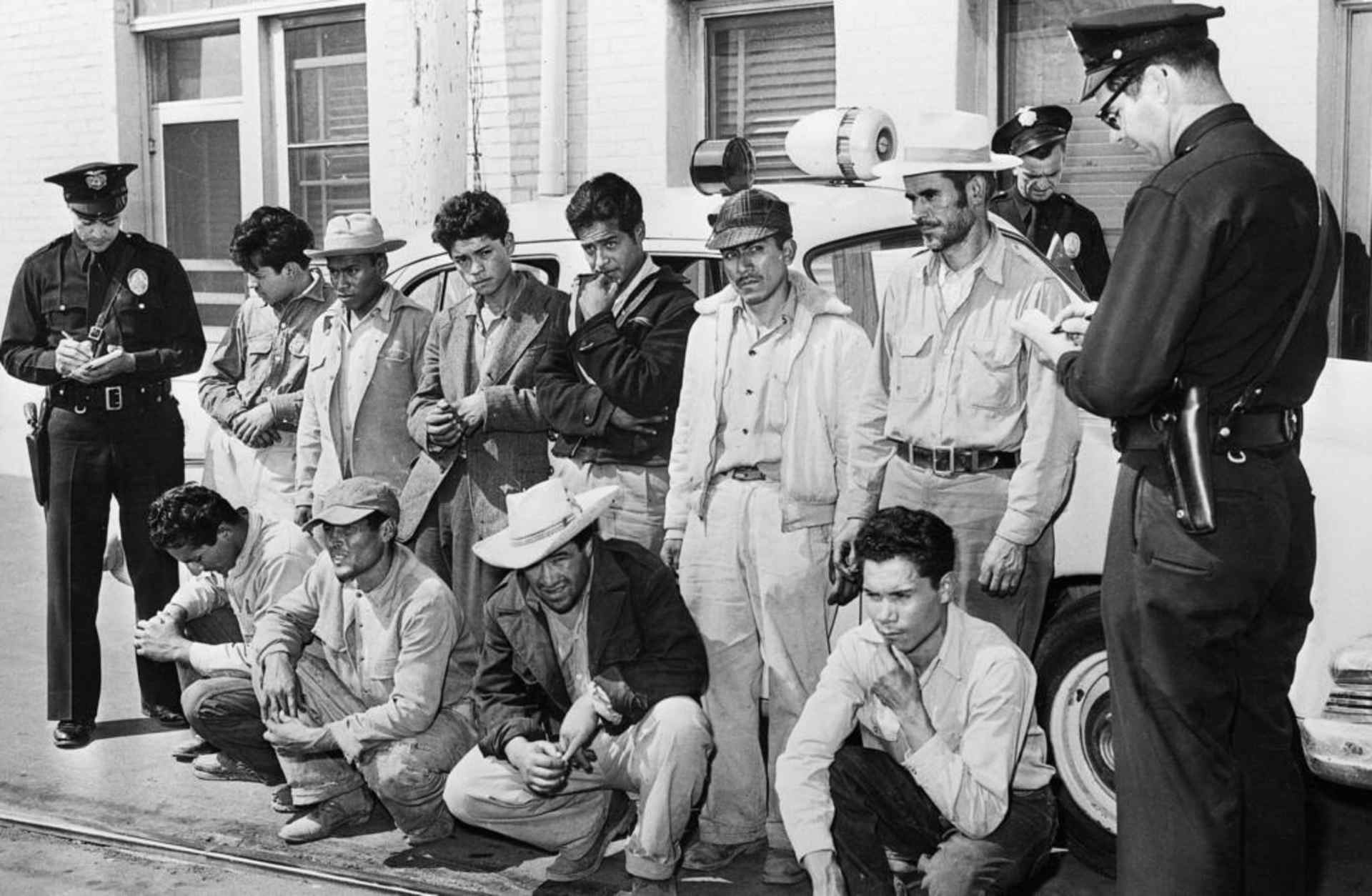 A group of Mexicans who were taken off freight trains in Los Angeles, after two days without food or water, in 1953. (Credit: Getty Images)