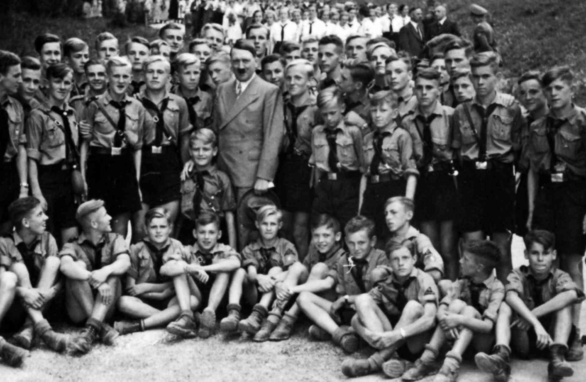 Adolf Hitler with Nazi party Hitler Youth at a 1935 gathering.