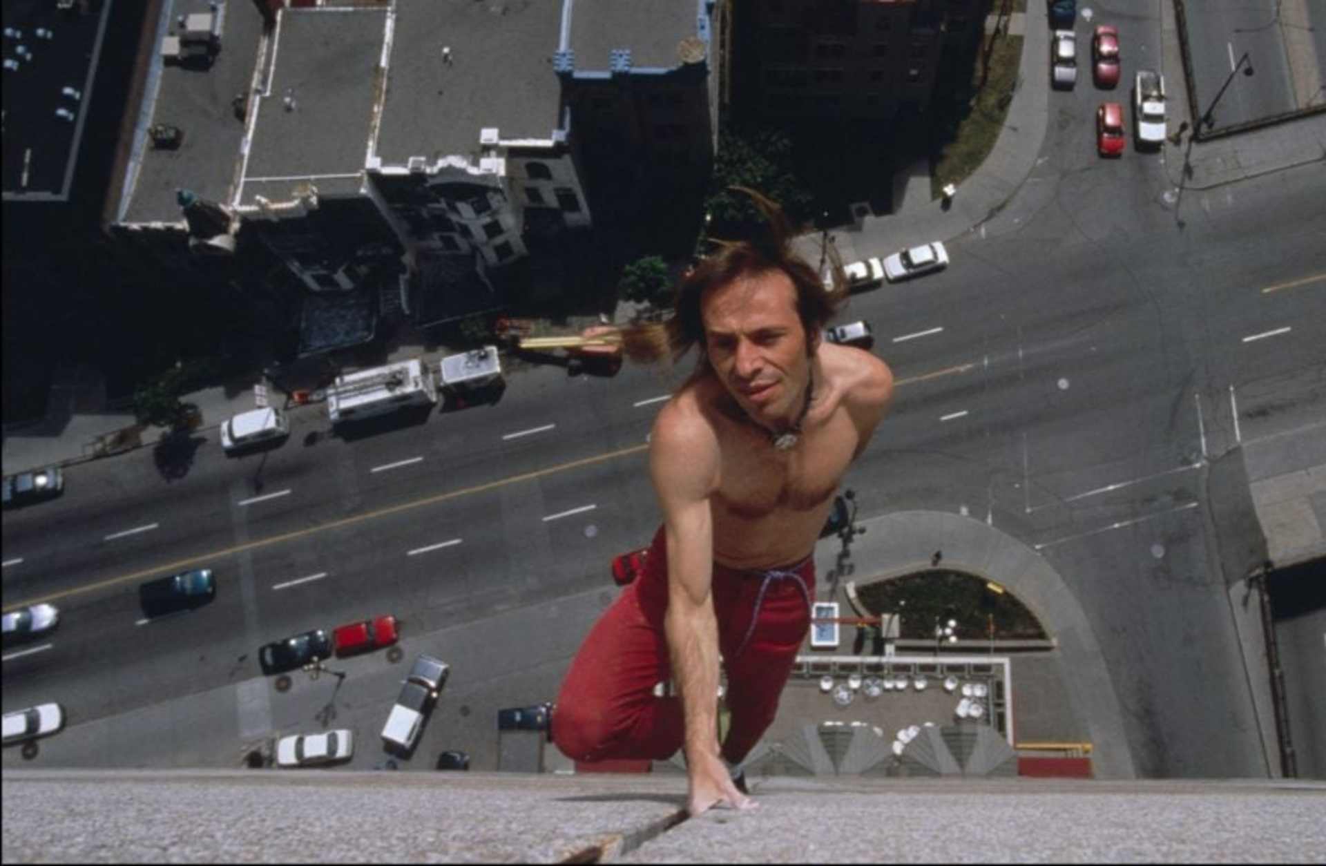 Alain Robert climbing from a hotel in Montreal on May 27, 1999.