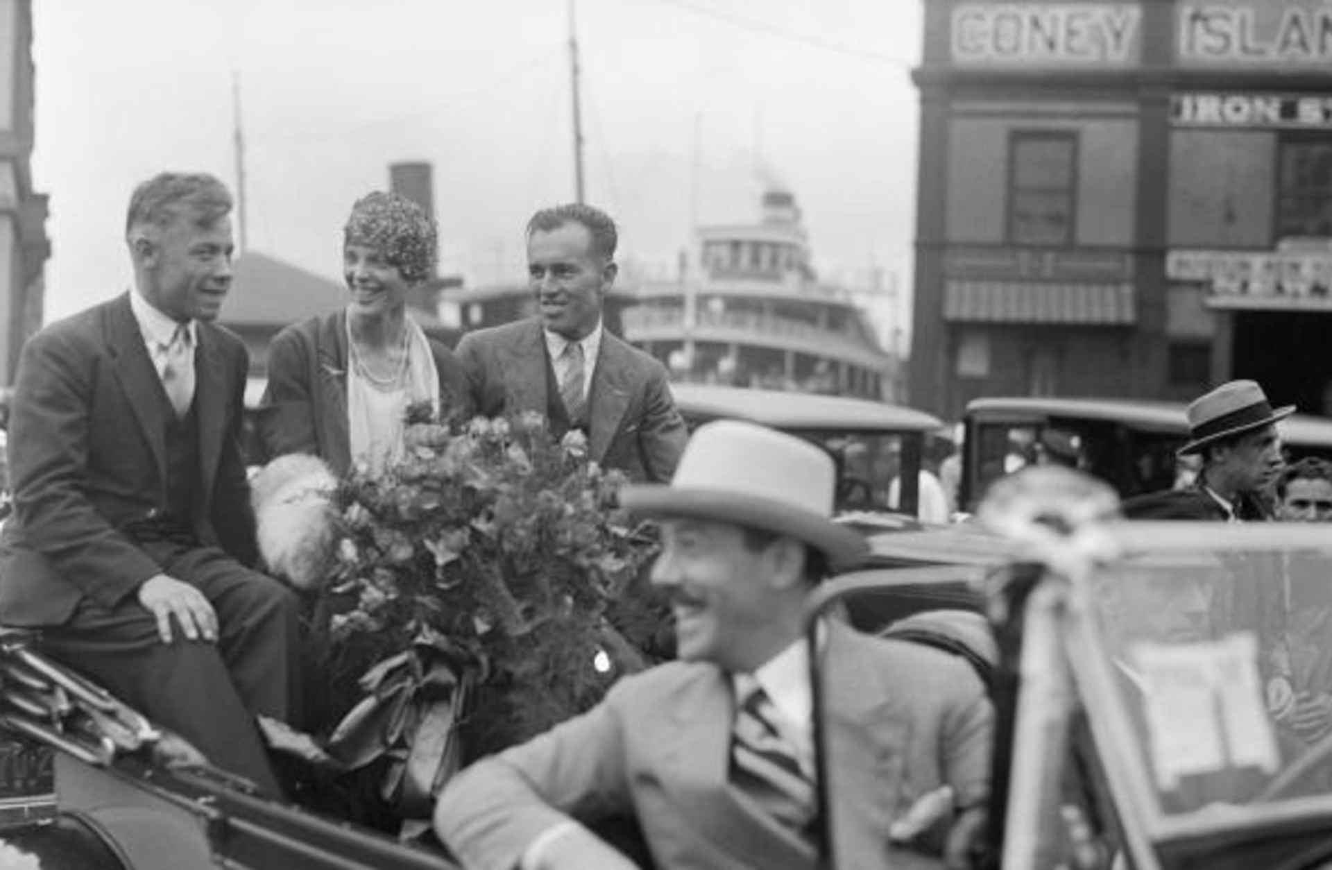 Amelia Earhart in a Parade reception after her Trans-Atlantic Flight in 1928 with pilots Wilmer Stultz and Luis Gordon. (Credit: Bettmann/Getty Images)