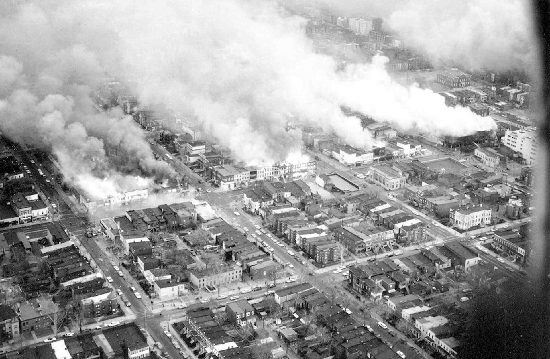 An aerial view of clouds of smoke rising from burning buildings in northeast Washington, D.C. on April 5, 1968. (Credit: AP Photo)