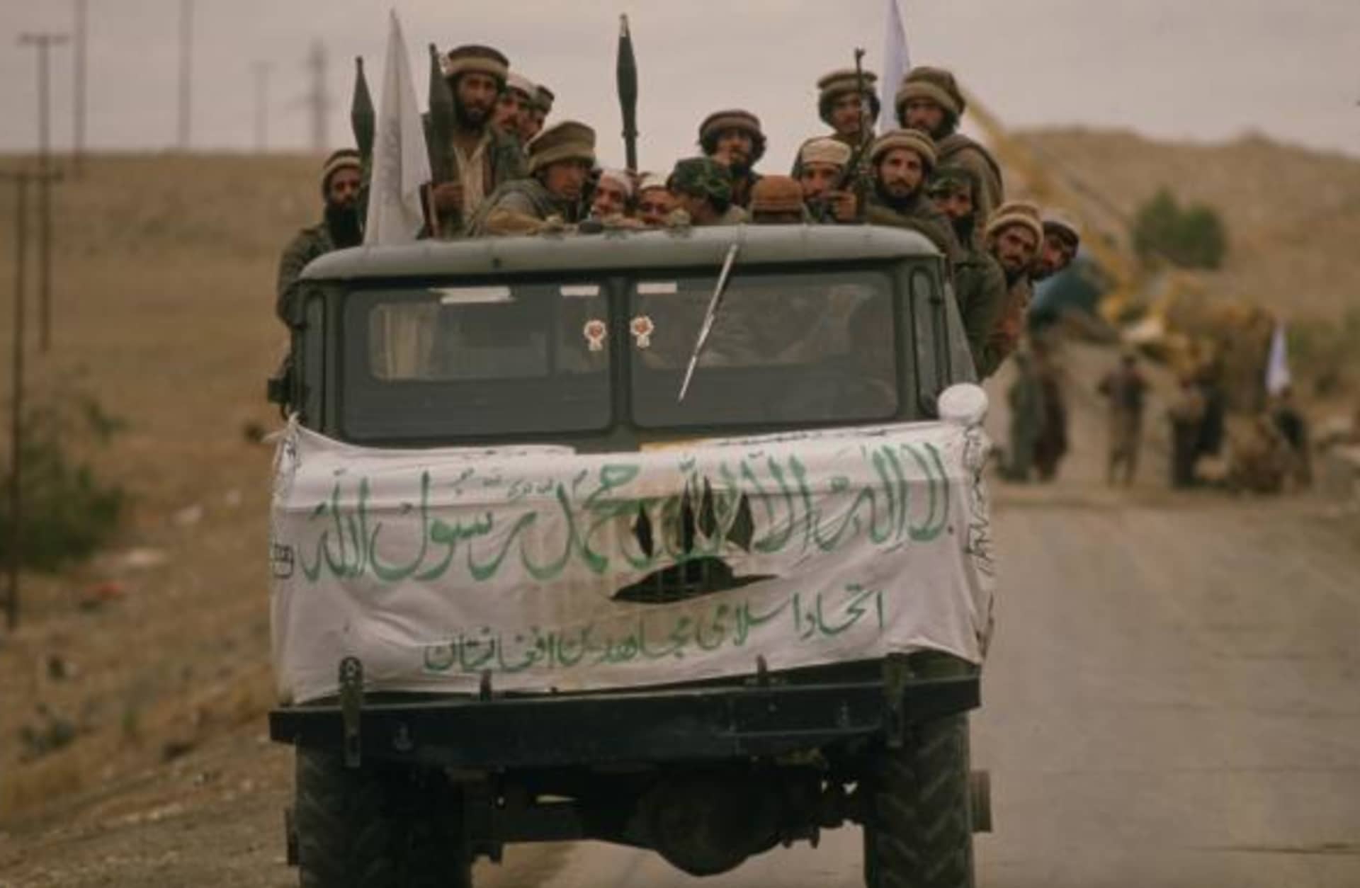 As part of their war against the Soviet forces invading Afghanistan, the Mujahidin, anti-Communist troops trained and supplied by the U.S.A., Saudi Arabia, Pakistan and other countries, have launched an offensive in the Jalalabad area. Pictured here is a truck full of armed Mujahidin soldiers arriving at the Samarkhel Mujahidin camp near the Jalalabad airport to back up the forces already present . (Credit: Patrick Durand/Sygma via Getty Images)