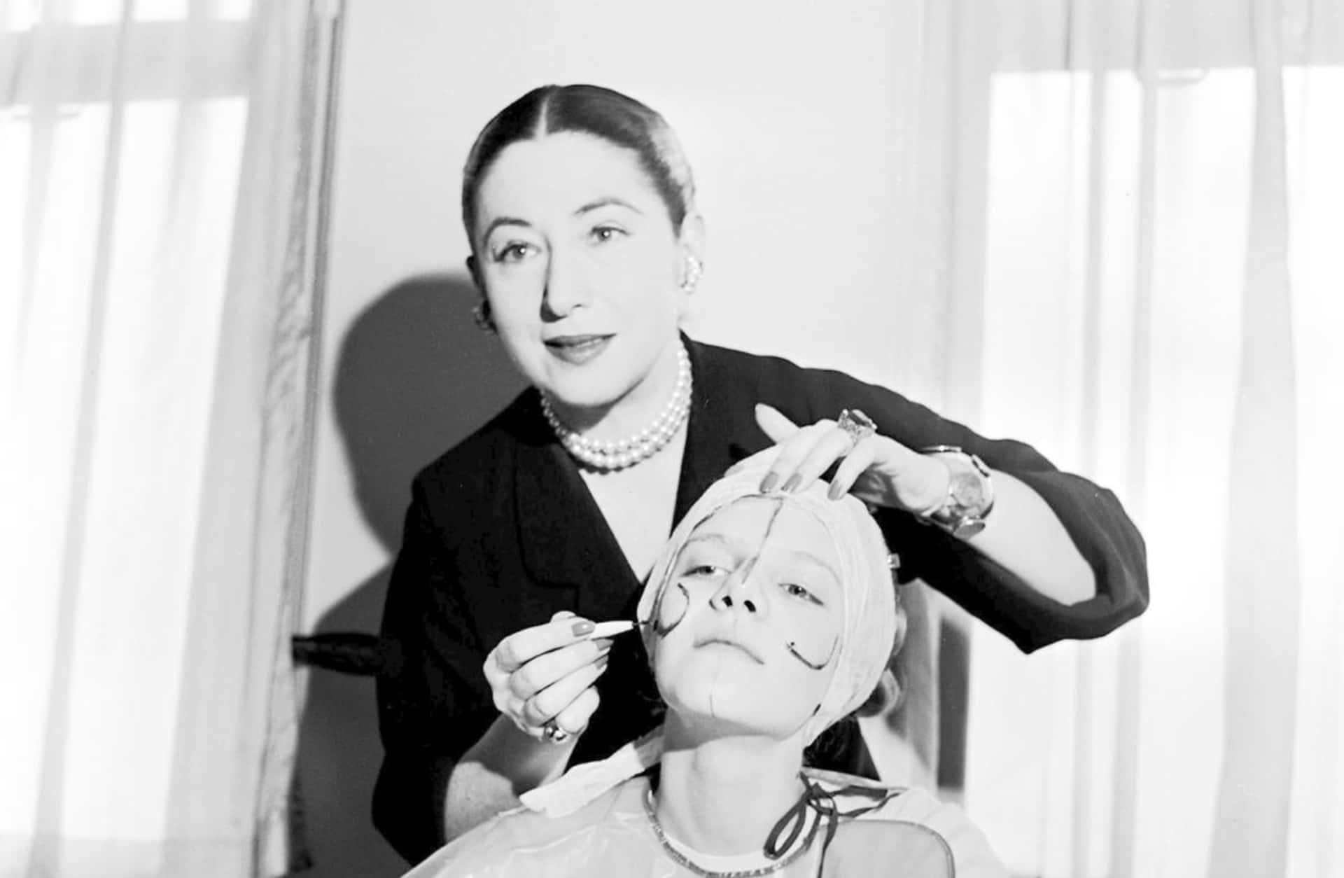 Beauty expert Helena Rubinstein illustrating the shape of the basic lines on the face so that make-up can be applied to flatter individual contours, 1935.