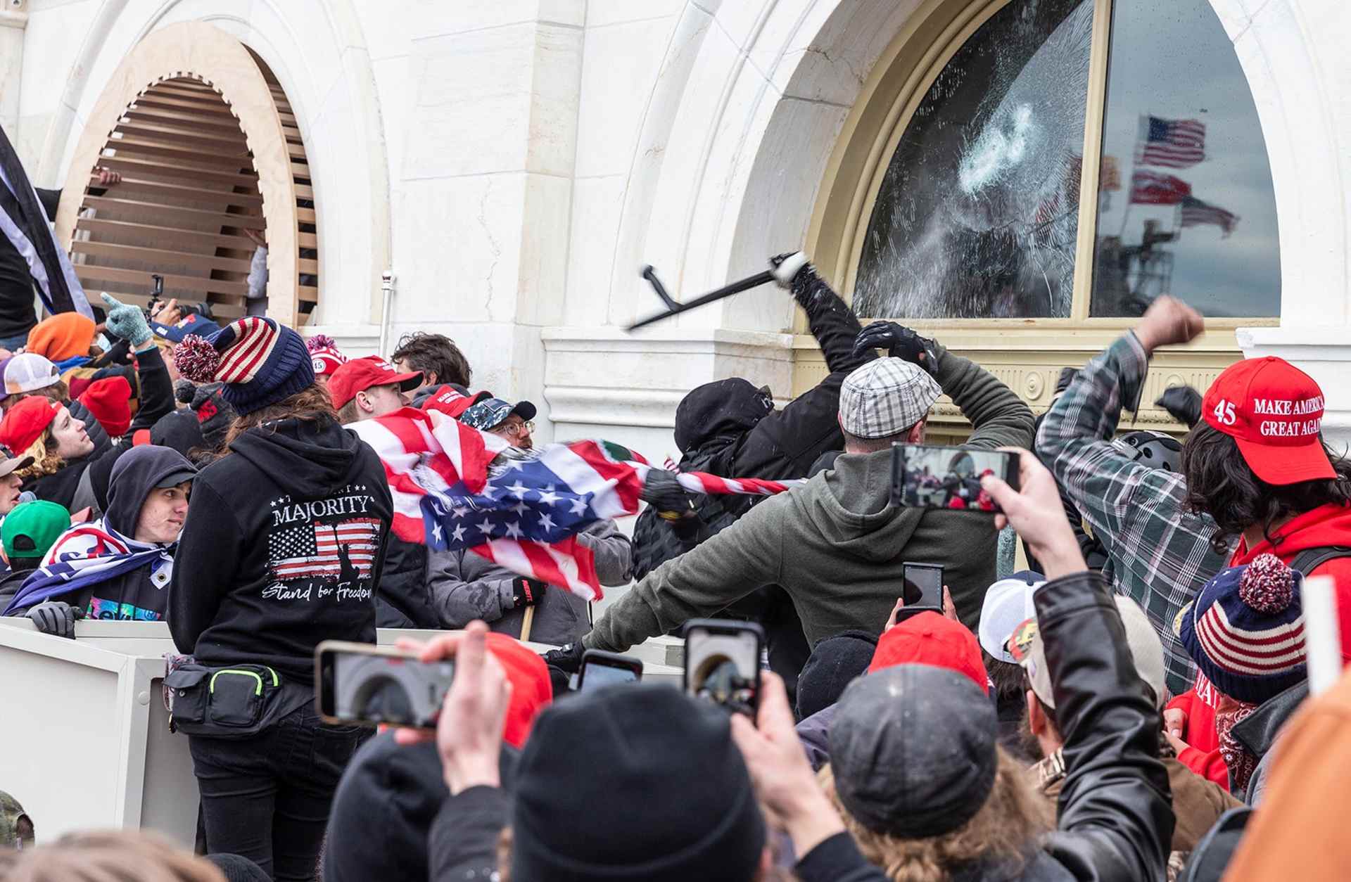 Protesters break windows of the U.S. Capitol building on January 6, 2021.