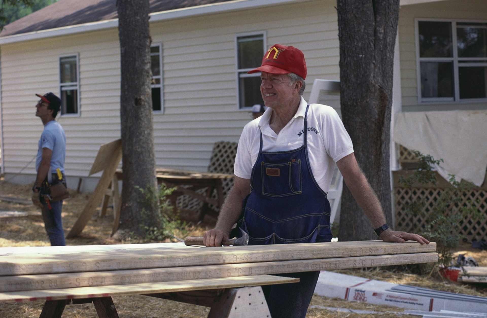 Former President Jimmy Carter as he works on a Habitat for Humanity house, Atlanta, Georgia, July 1988.