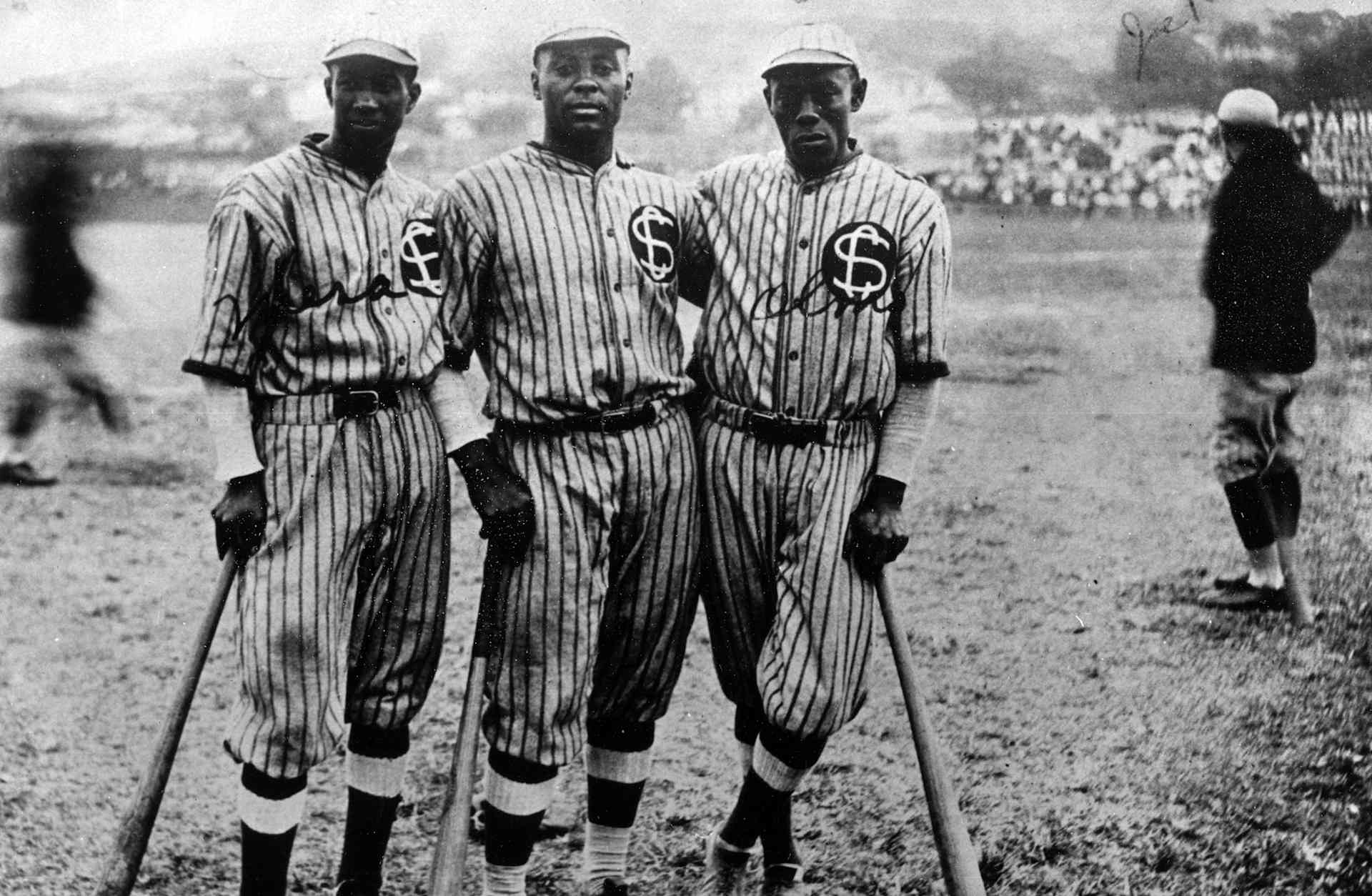 Oscar Charleston (center) poses with teammates during a 1924 game in Cuba.