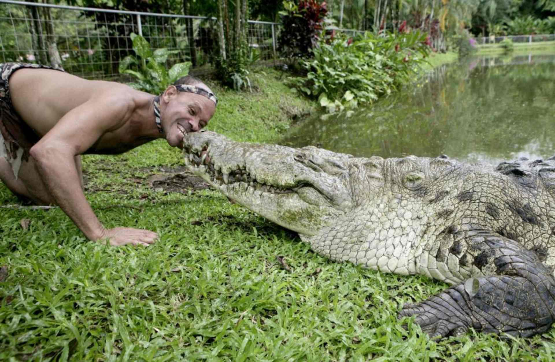 Chito with his pet crocodile Pocho, 2009. (Credit: Barry Bland/Barcroft Media/Getty Images)