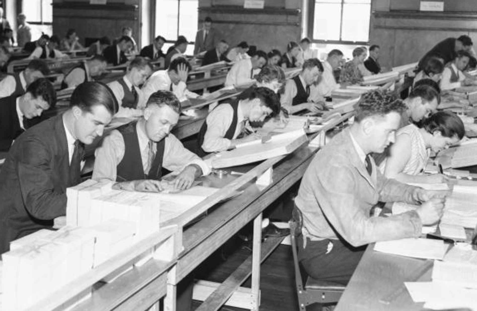 Clerks working in the U.S. Census Bureau office at St. Louis, cataloguing the names of the 75,994,575 Americans listed in the 1900 census, which was used to determine the Social Security rolls.