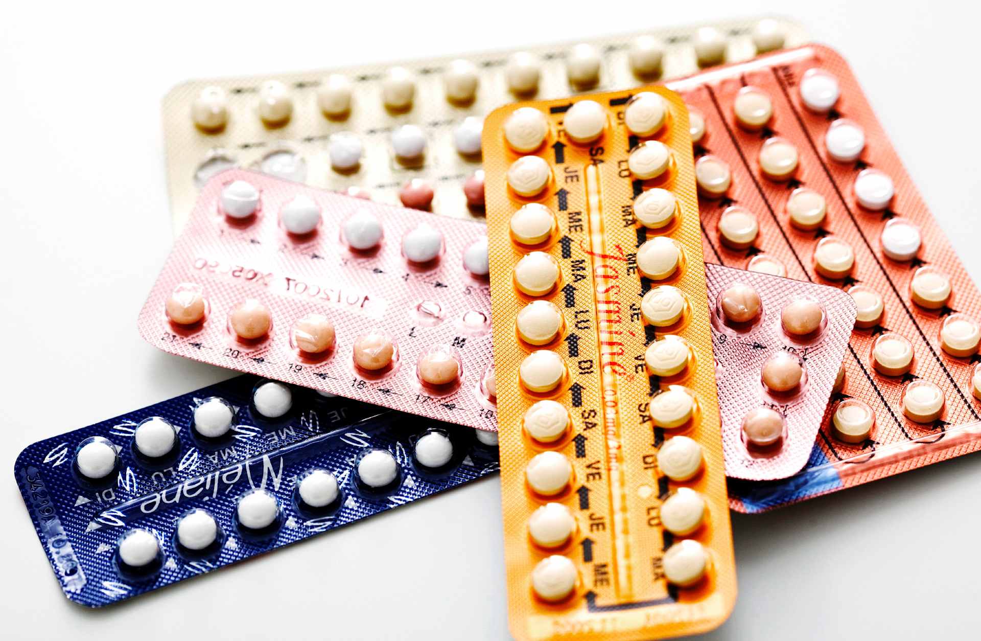 A small pile of packaged contraceptive pills.
