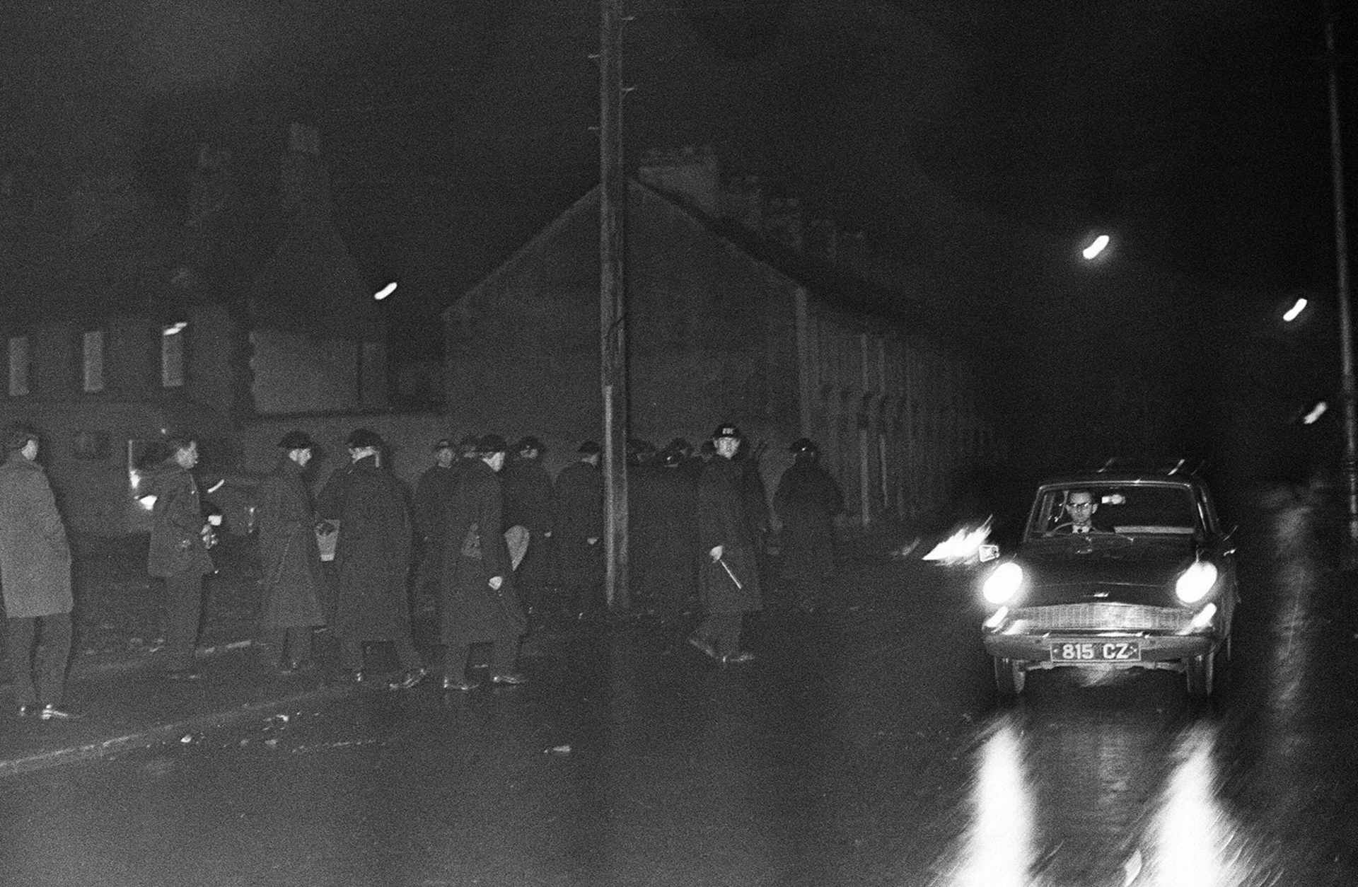 Londonderry riots aftermath. A petrol bomb which was thrown at a police van (left) is pictured burning out in Rossville Street. October 1968.
