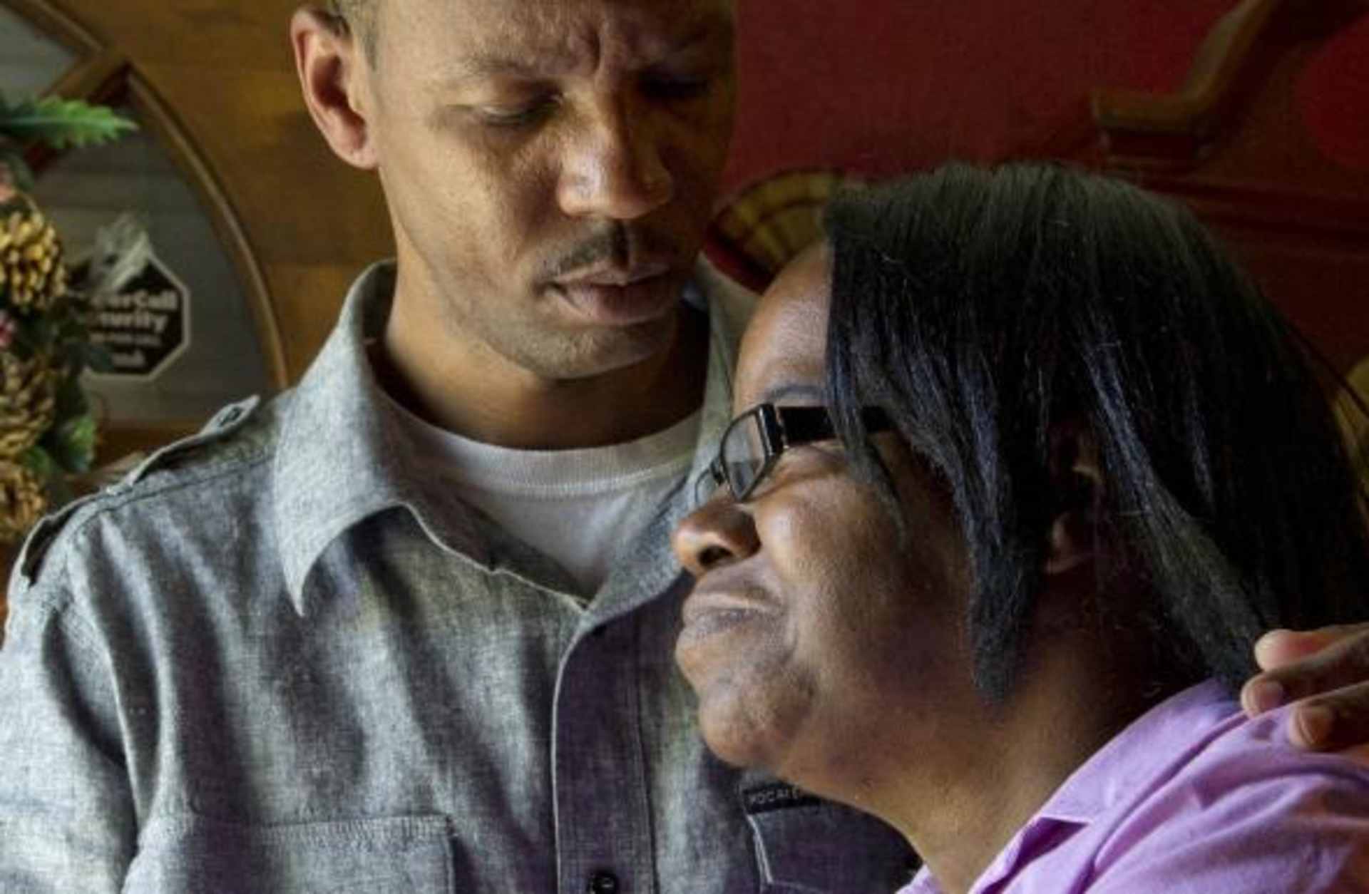 Florence Whitehurst, wife of Bernard Whitehurst, embraced by her son Stacy at her Montgomery home. (Credit: Dave Martin/AP Photo)