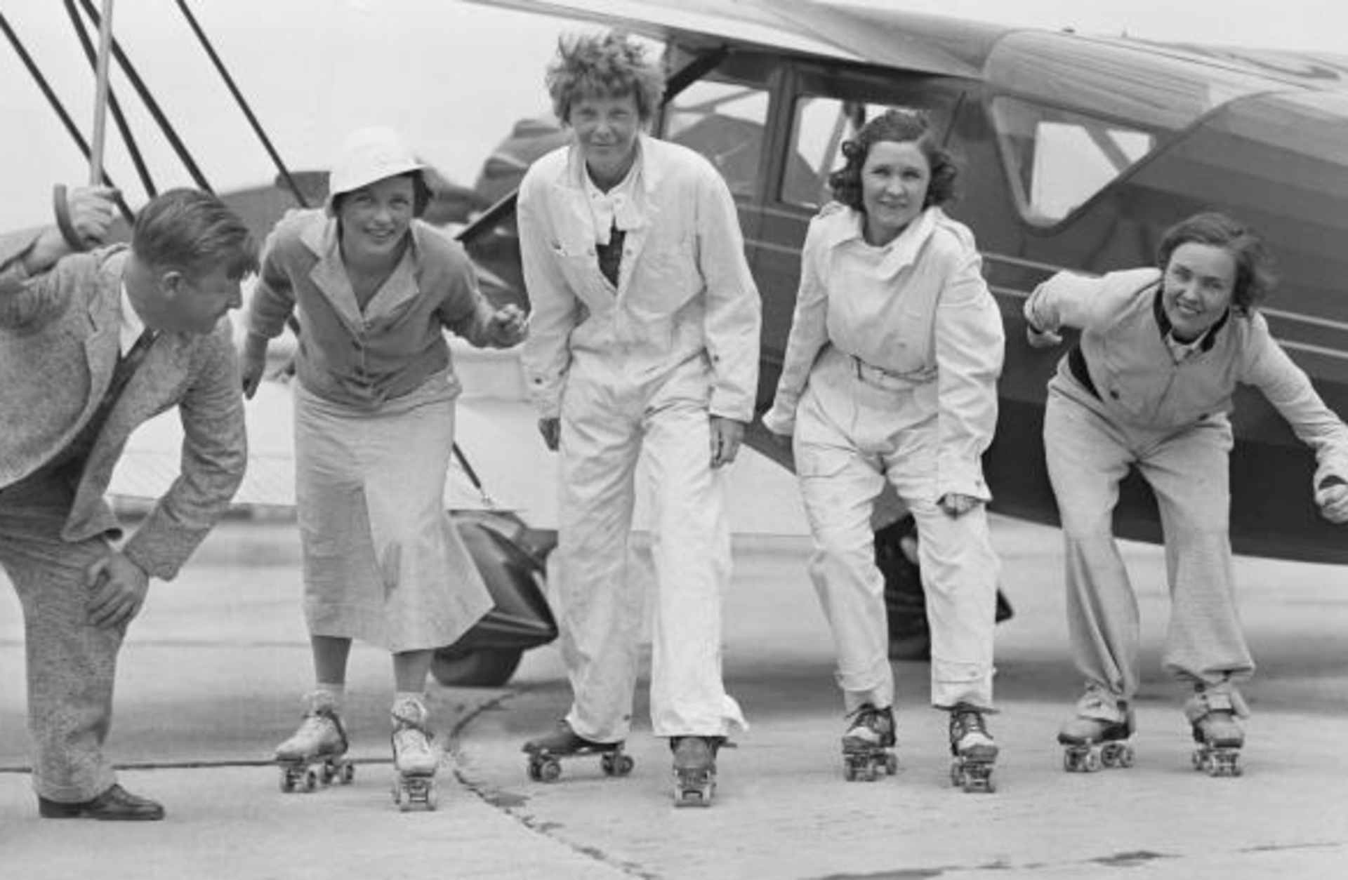 Flyers Amelia Earhart Putnam, Frances H. Marsalis, Elvy Kalep, and Betty Gillies rehearsing for a skating party that was held in a hangar by the "Ninety Nines." (Credit: Bettmann/Getty Images)