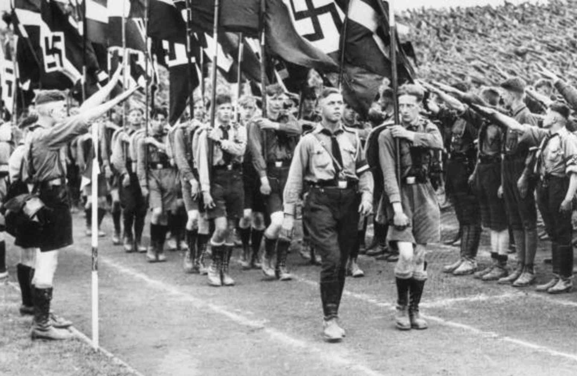 Germany's young fascists receive famous salute during a mass march in Berlin, 1934. (Credit: Bettmann/Getty Images)