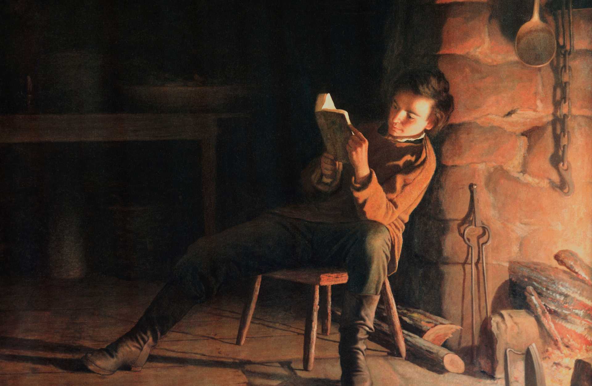 Artist Eastman Johnson's 1867 oil painting 'Boyhood of Lincoln,' depicting a young Abraham Lincoln reading by firelight