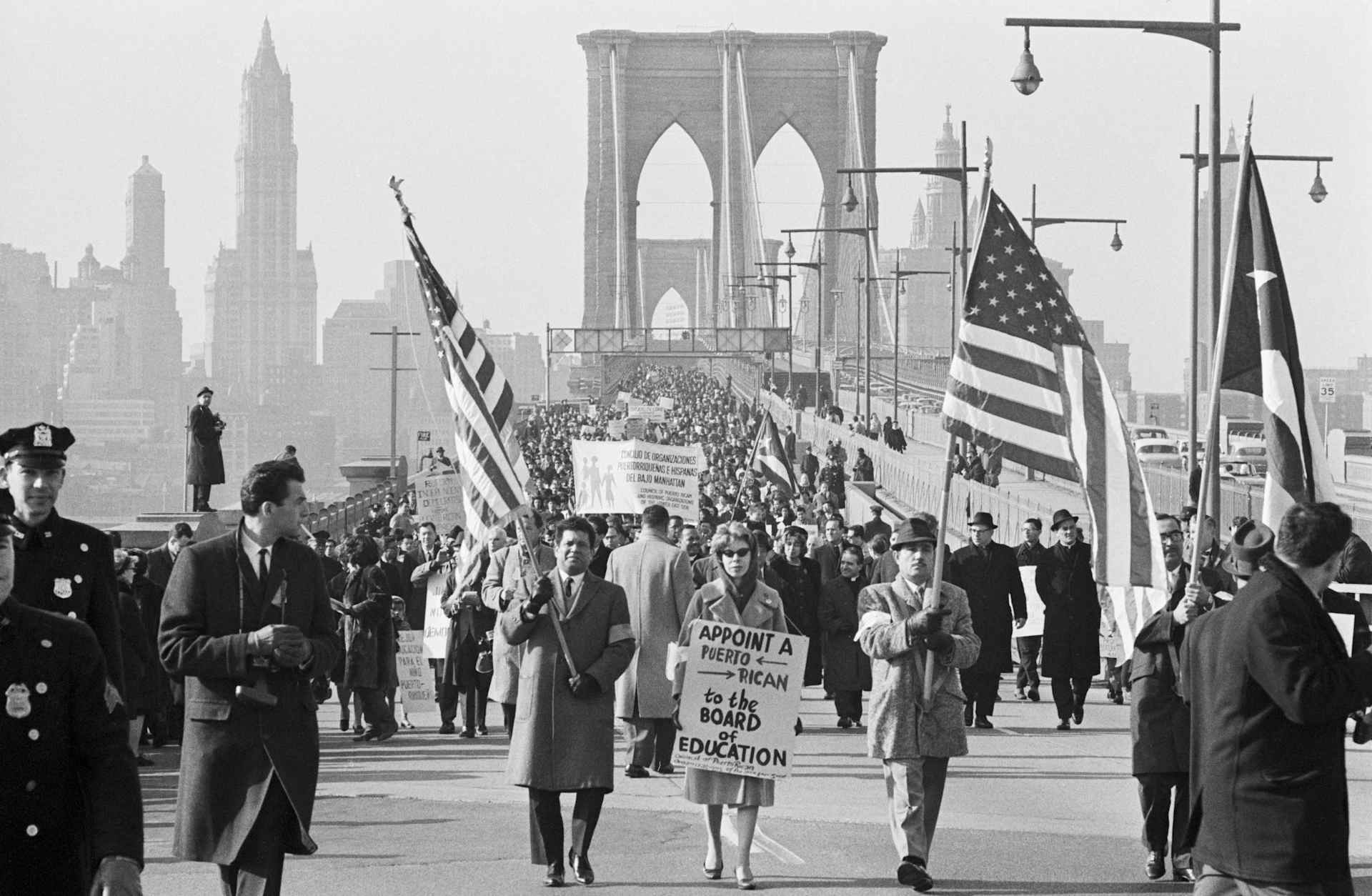 March 1, 1964: Puerto Rican demonstrators walk in silence from City Hall in Manhattan across the Brooklyn Bridge to the Board of Education offices during a protest. Sponsored by the National Association for Puerto Rican Civil Rights, the march demanded improved education facilities for the city's Puerto Rican communities.