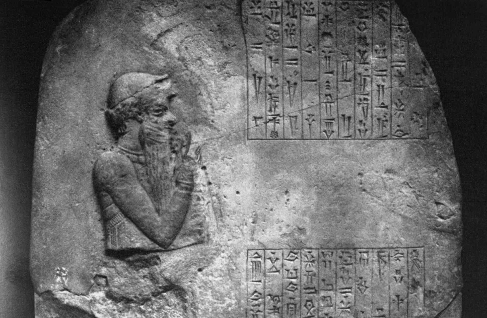 Hammurabi, renowned king of the first dynasty of Babylon, with part of his laws, as depicted on a limestone votive monument in London's British Museum.