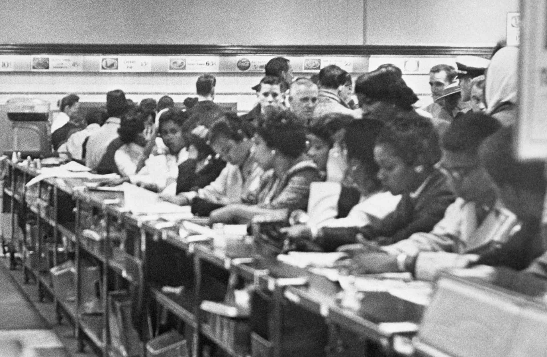 Demonstrators line the counter at the F.W. Woolworth Co.