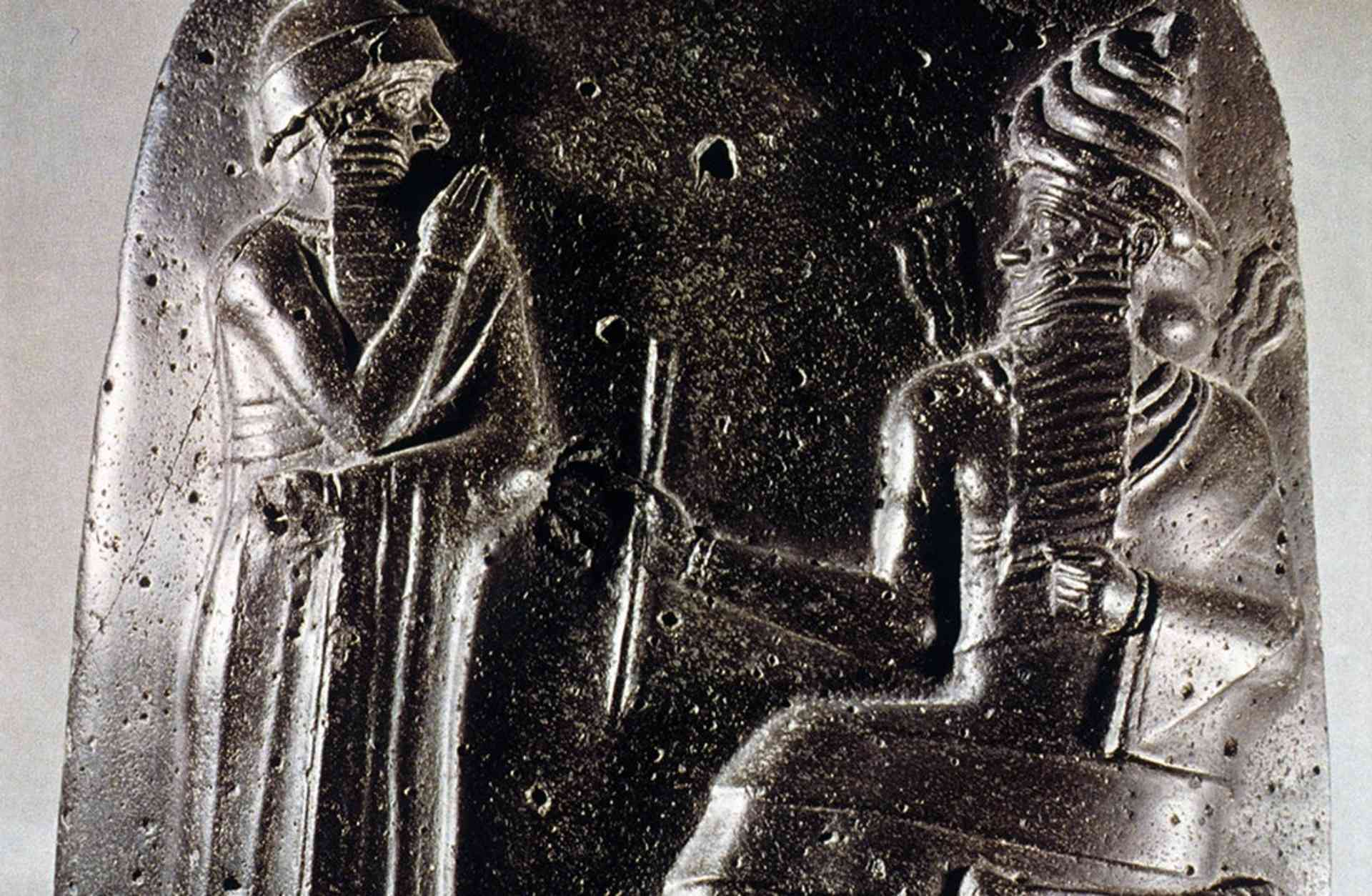 King Hammurabi receiving the law (Code of Hammurabi) from the hand of the sun deity Shamash.