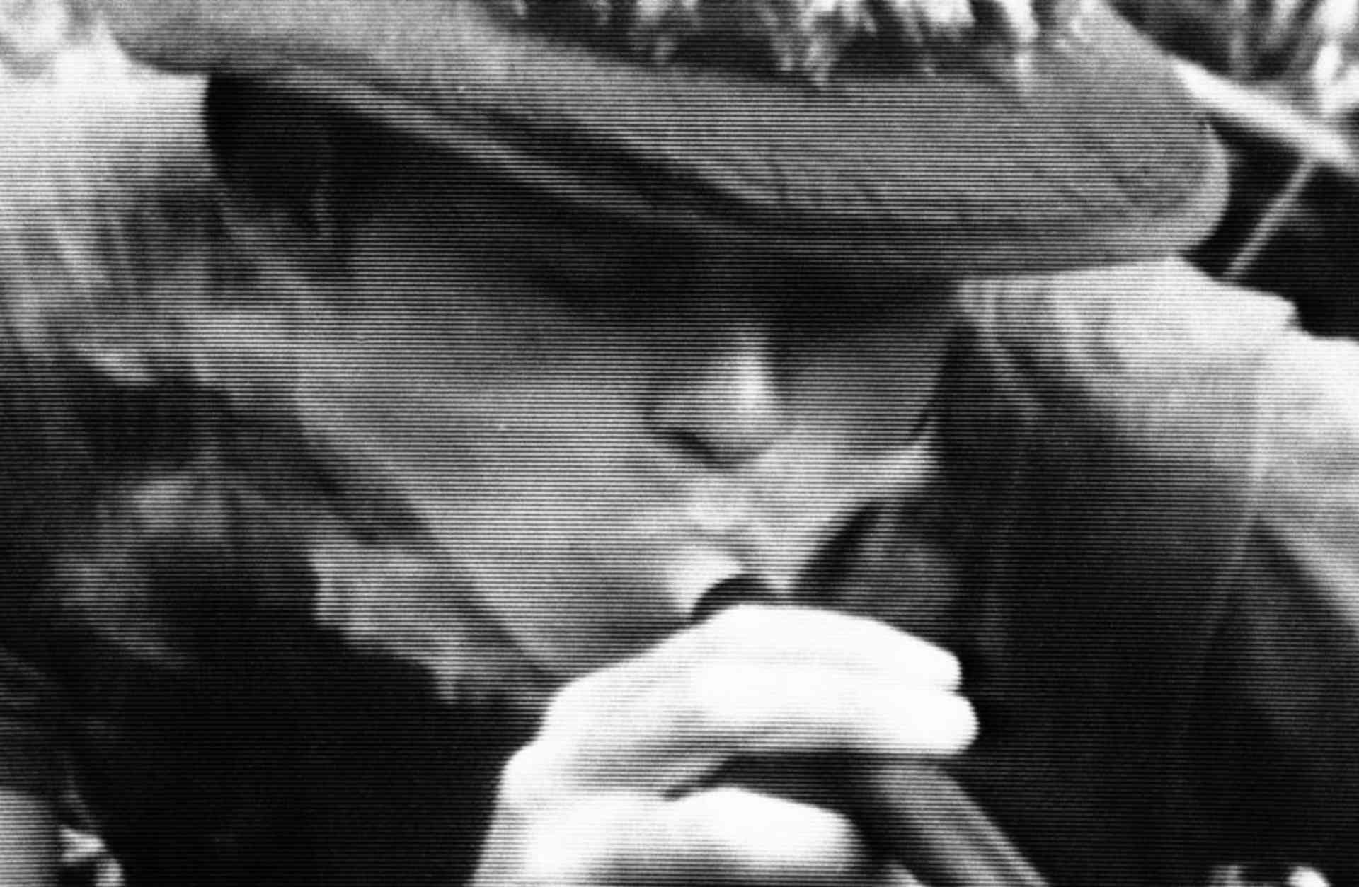 In this photo taken from video, soldiers in fire-support base Aries, a small clearing in the jungles 50 miles from Saigon, smoke marijuana using the barrel of a shotgun they nicknamed "Ralph." 1970. (Credit: Jim Wells/AP Photo)