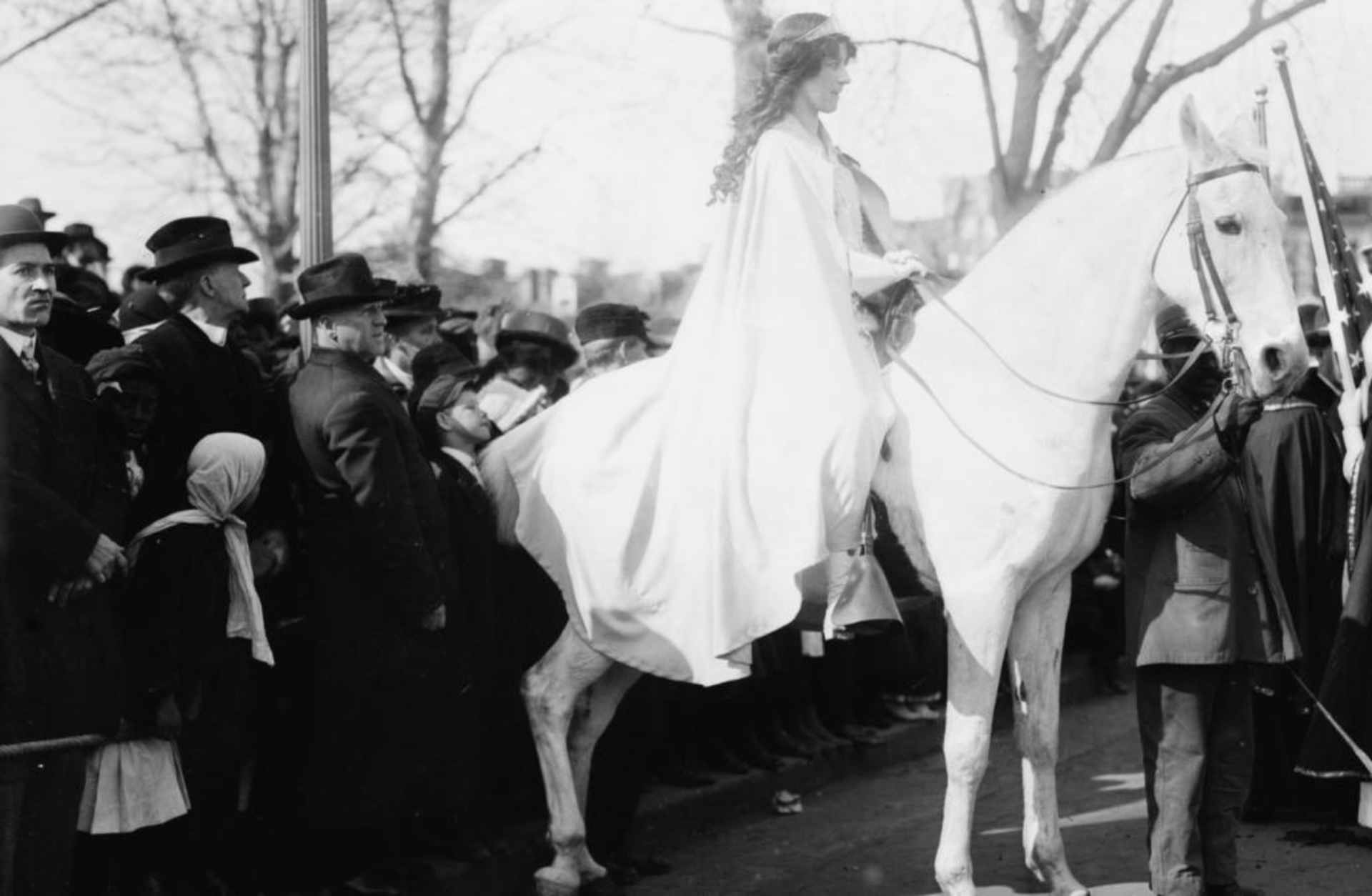 Inez Milholland, wearing a white cape while seated on white horse, at the National American Woman Suffrage Association parade, March 3, 1913. (Credit: F A Archive/REX/Shutterstock)