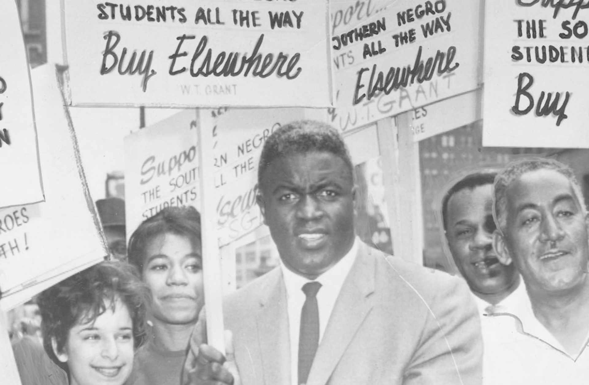 Jackie Robinson holding a sign in support of the NAACP and black students in the South, 1955. (Credit: Afro American Newspapers/Gado/Getty Images)