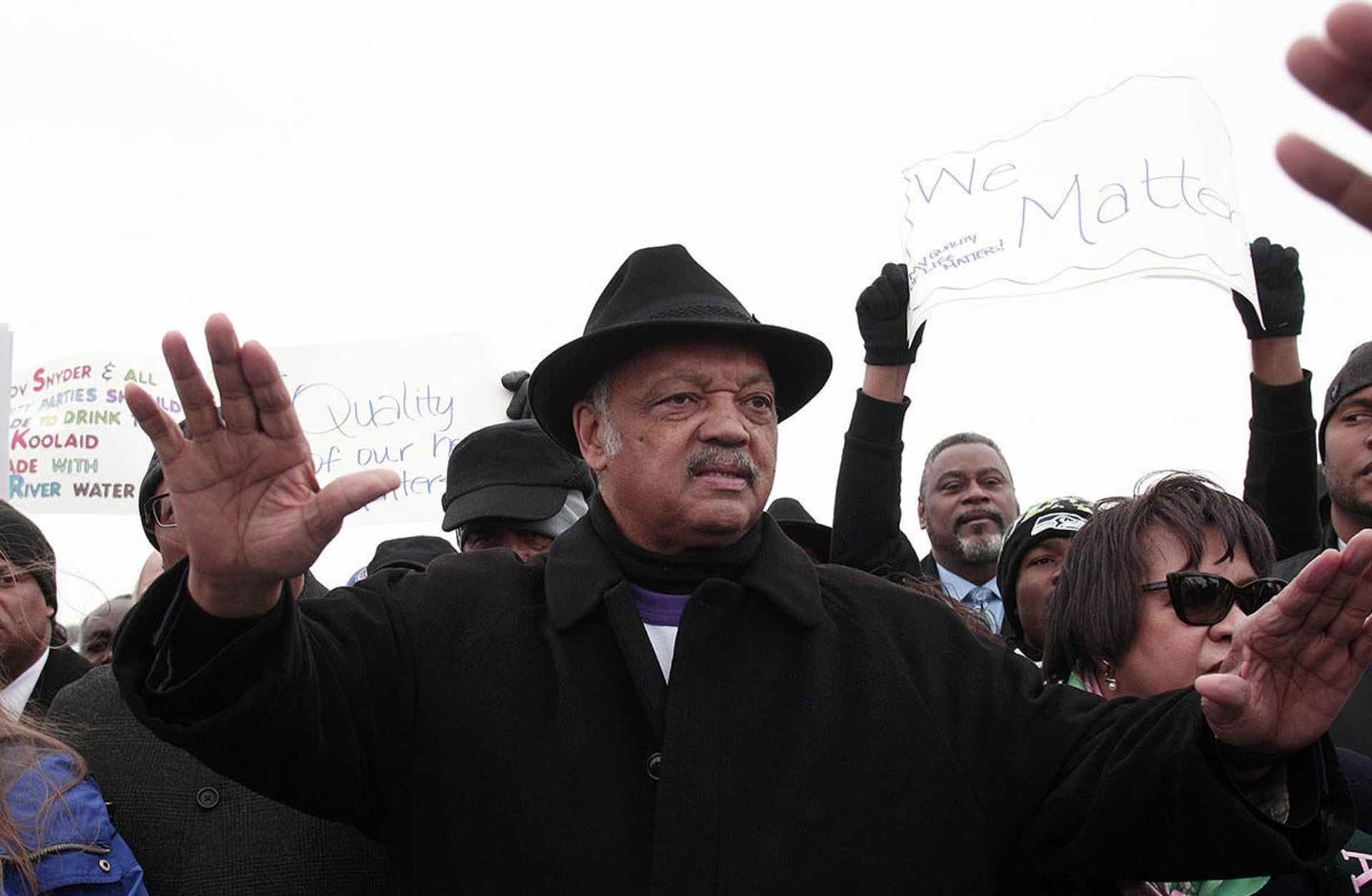 Jesse Jackson walking in a national mile-long march he helped organize to highlight the push for clean water in Flint, Michigan, 2016. (Credit: Bill Pugliano/Getty Images)