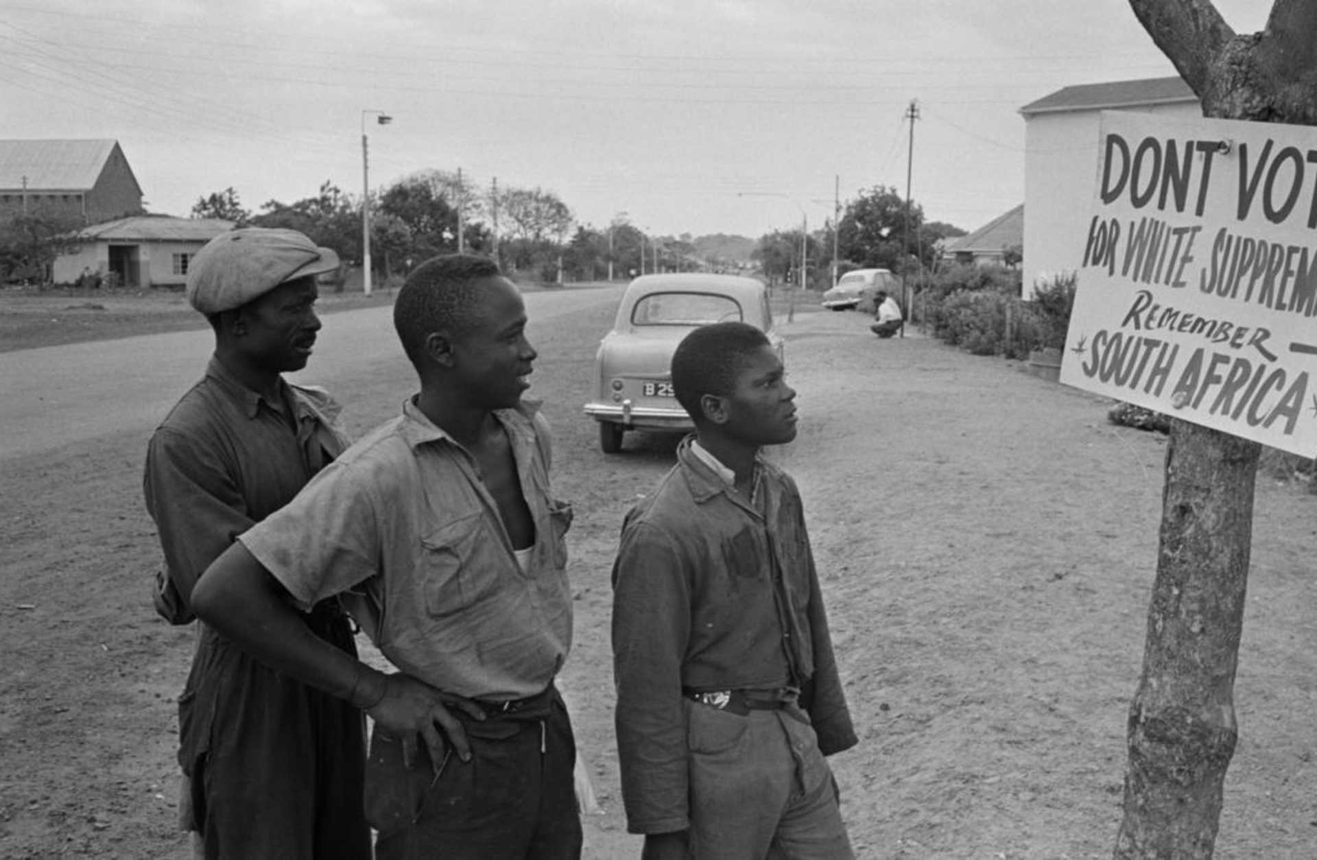 Local residents reading a voting sign during elections in Southern Rhodesia, 1964. (Credit: Daily Express/Hulton Archive/Getty Images)