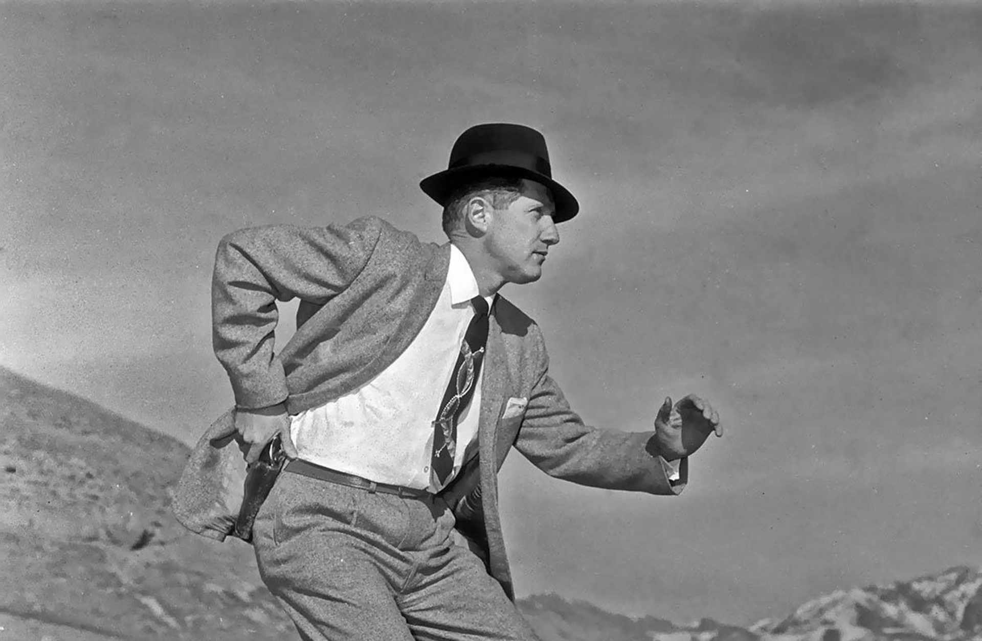 Mark Felt posing for a picture with his pistol drawn for a newspaper story in 1958. (Credit: Howard Moore/Deseret Morning News/Getty Images)