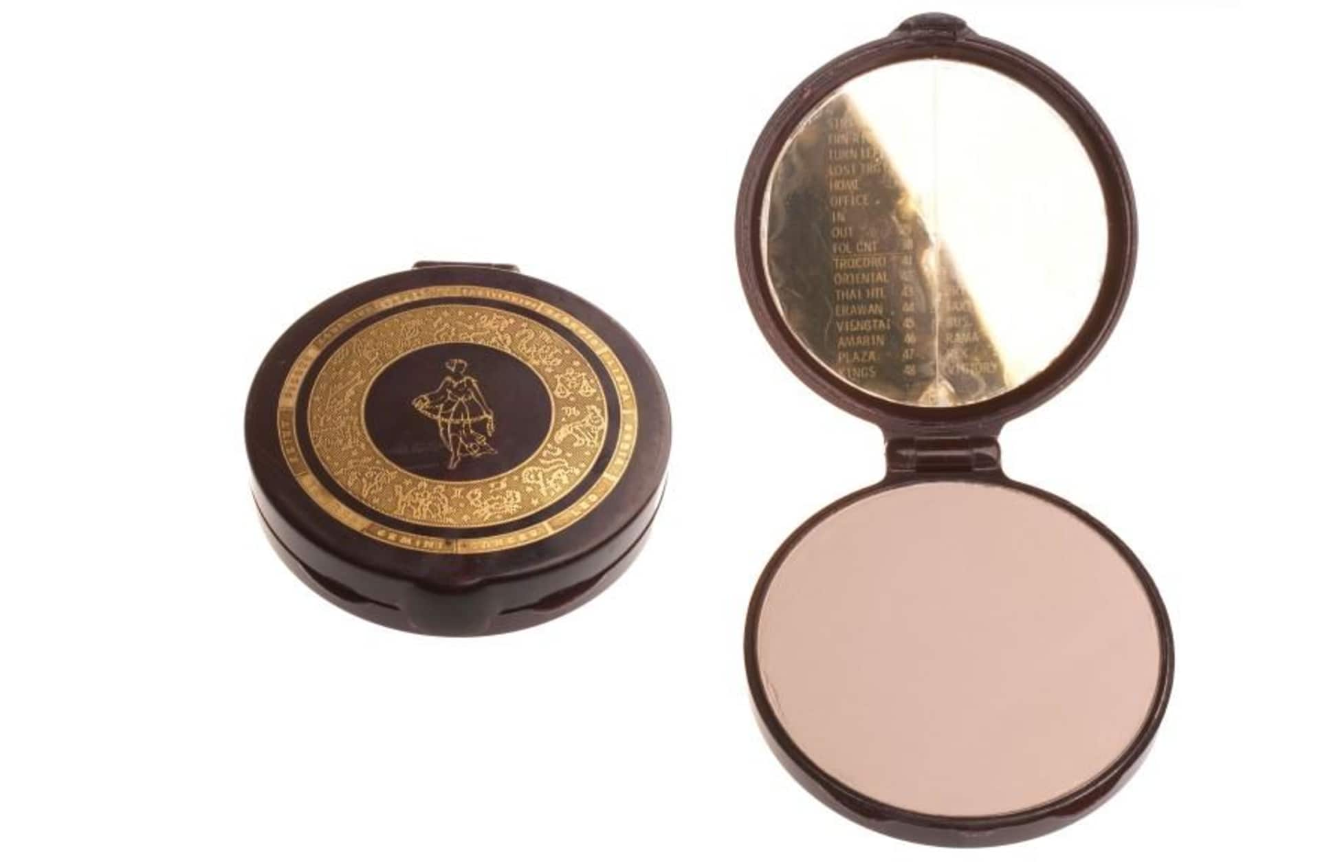 makeup compact with secret text message encoded in the mirror