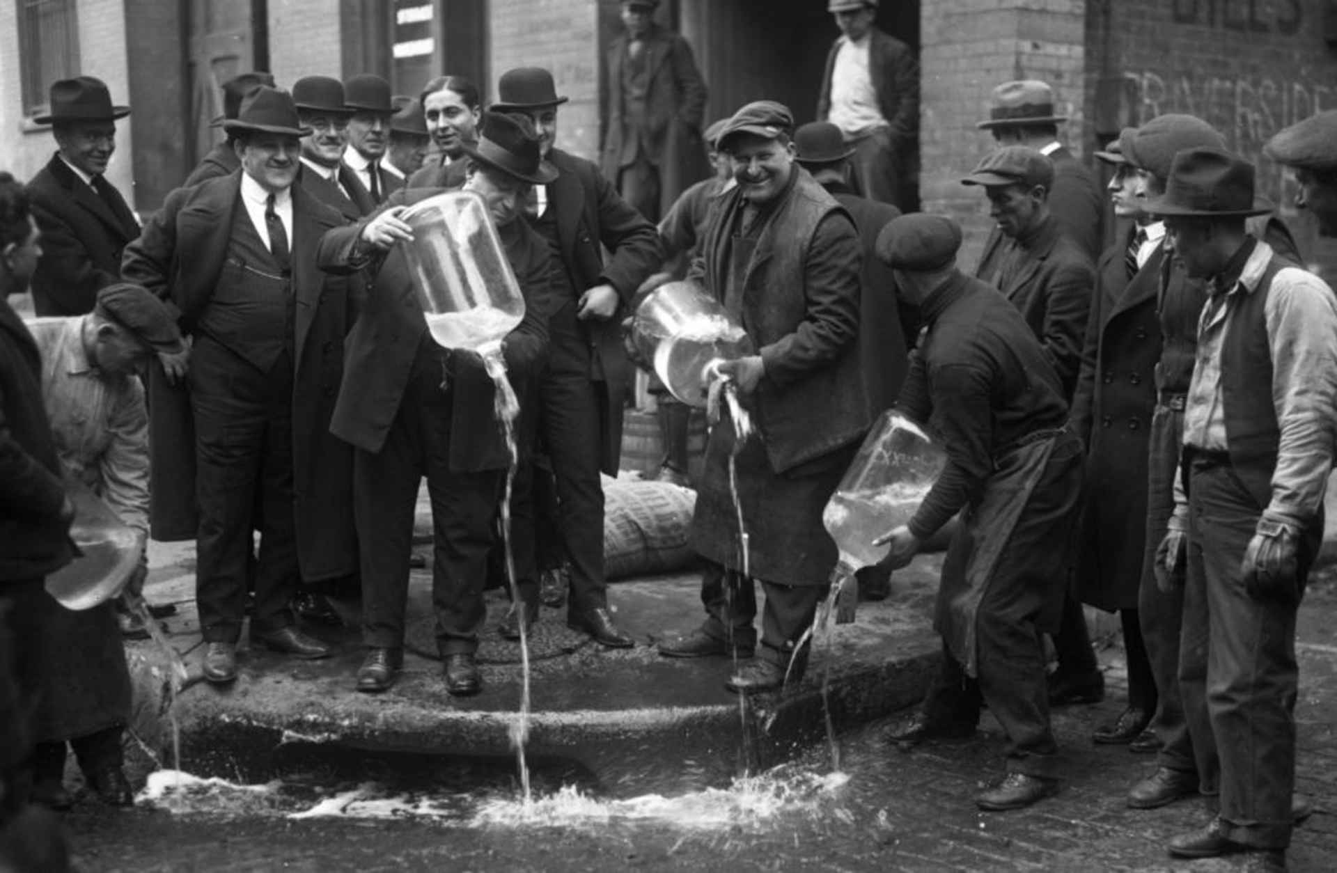 New York City Liquor Agent Izzy Einstein dumping liquor into the gutter during prohibition. (Credit: Daily News/NY Daily News via Getty Images)