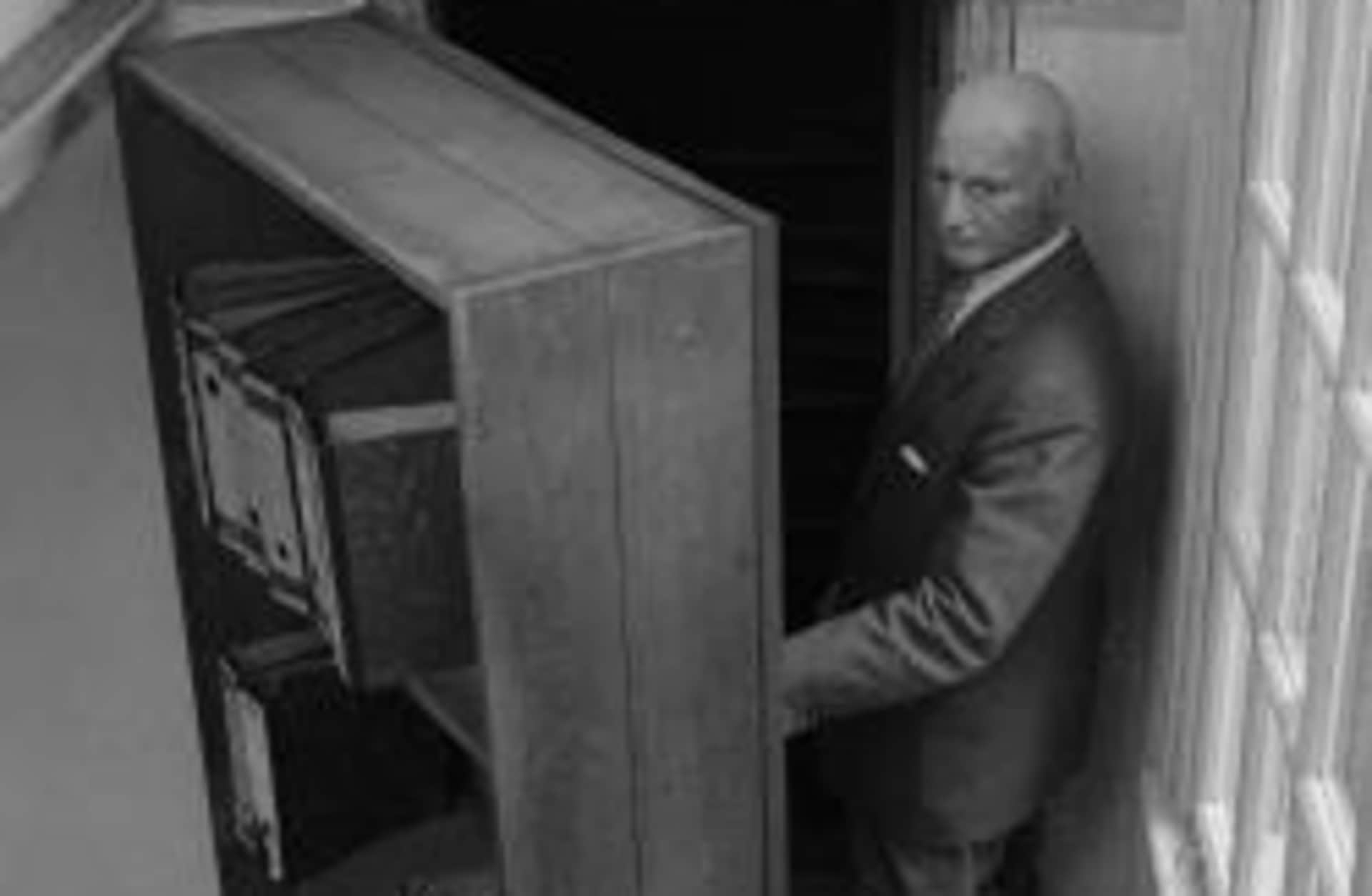 Otto Frank in front of the annex's bookcase, July 1964. (Credit: CBS/Getty Images)