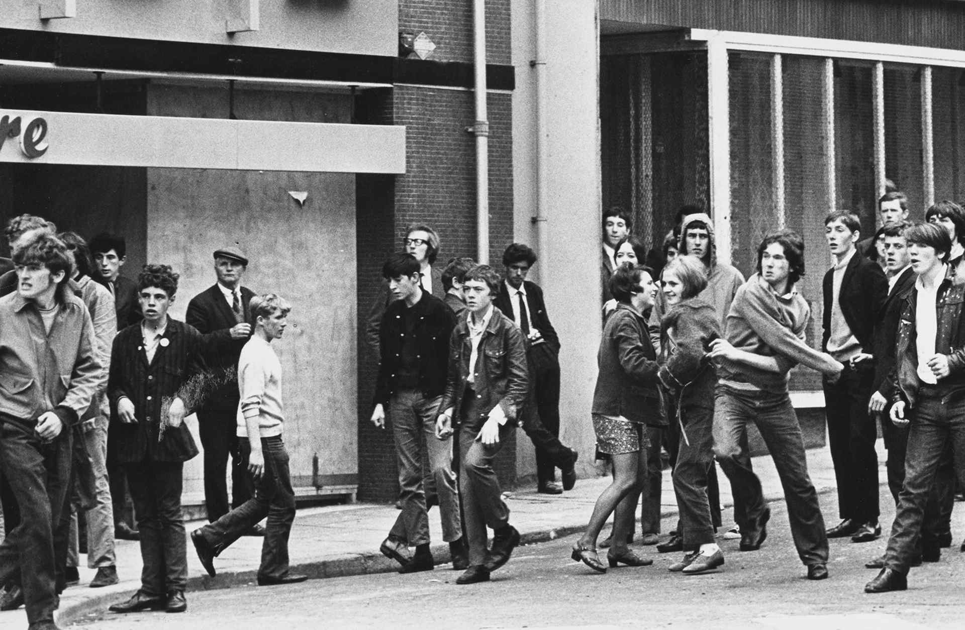 Rioters throwing rocks and stones as trouble flared following the annual Apprentice Boys parade through the streets on Derry, Northern Ireland, August 13, 1969.