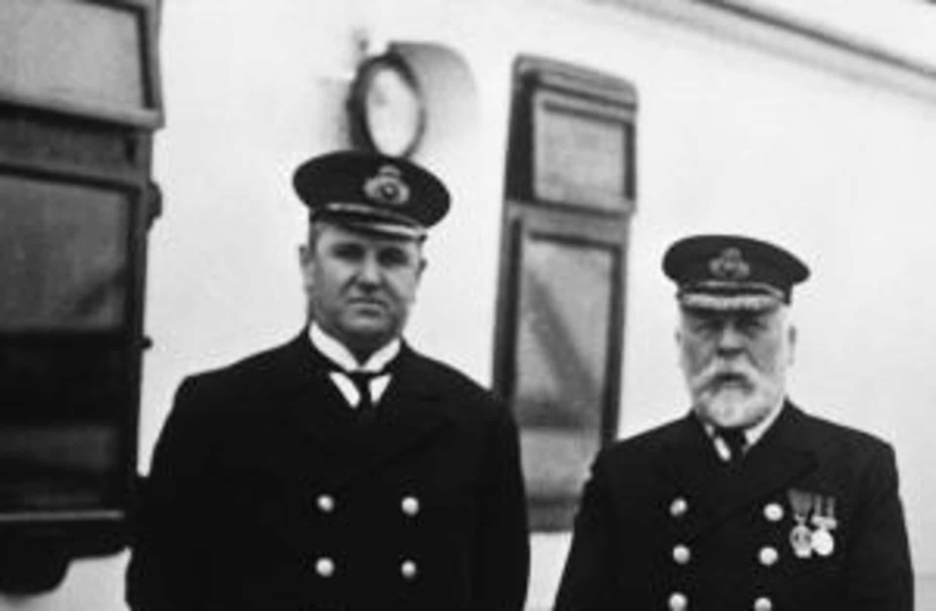 Purser Hugh Walter McElroy and Captain Edward J. Smith aboard the Titanic during the run from Southampton to Queenstown, England. The man who took the photograph, F.M. Browne, got off at Queenstown, three days before the ship hit an iceberg and sank.