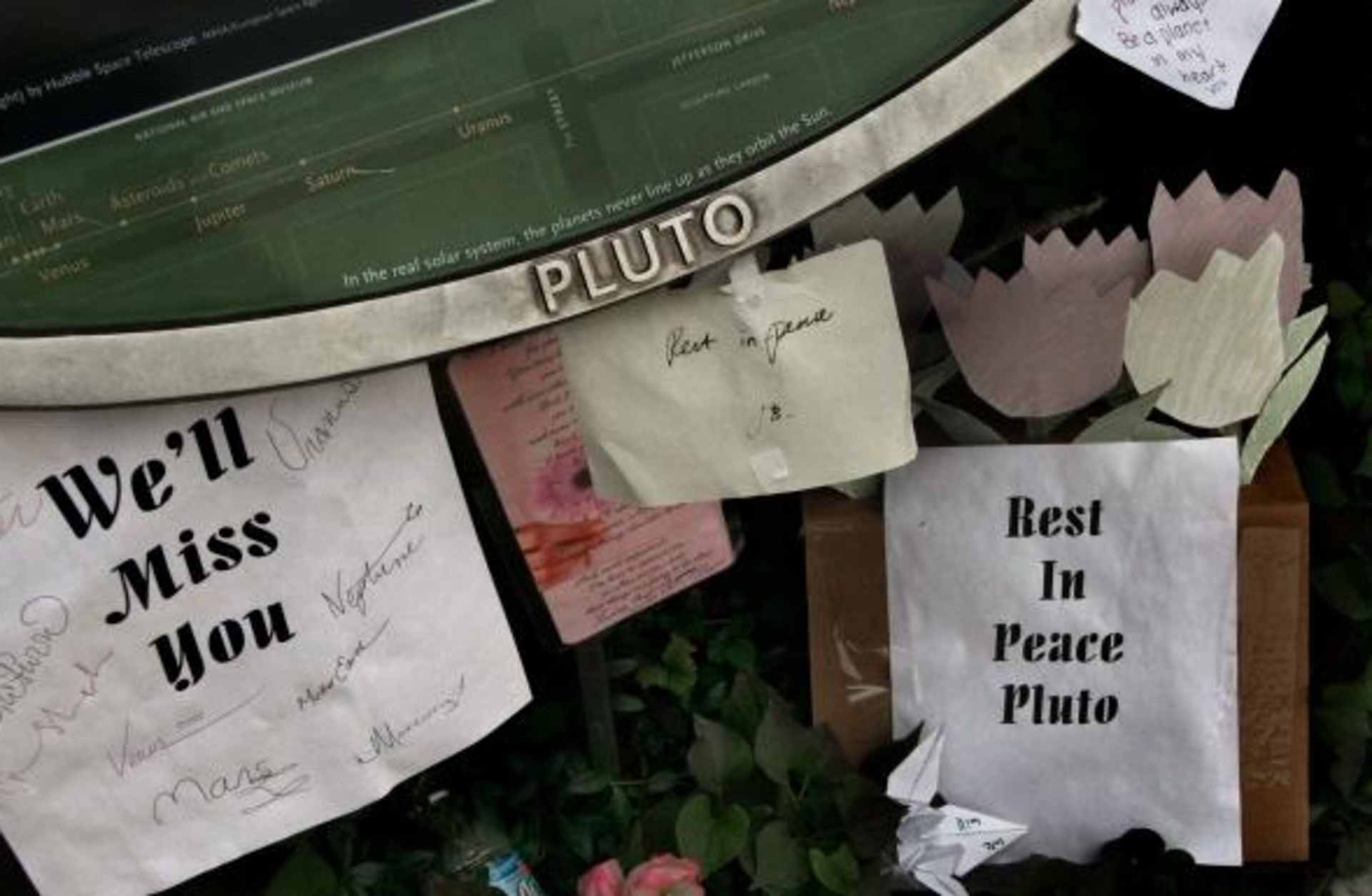 Rest in Peace signs for Pluto near the Smithsonian. (