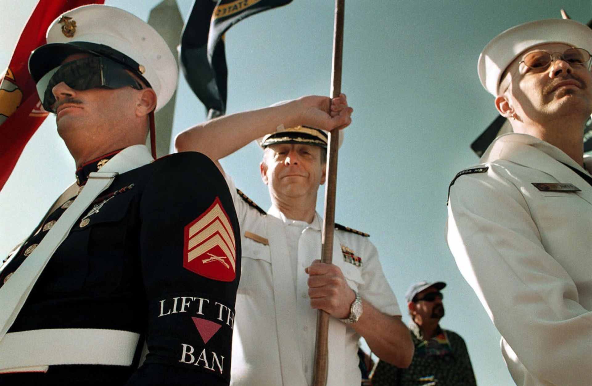 Retired Sgt. Tom Swann wears a "lift the ban" armband to protest the Don't Ask, Don't Tell policy against gays in the military. At center is Navy Capt. Mike Rankin. All were part of the Gay, Lesbian, Bisexual Veterans of America.