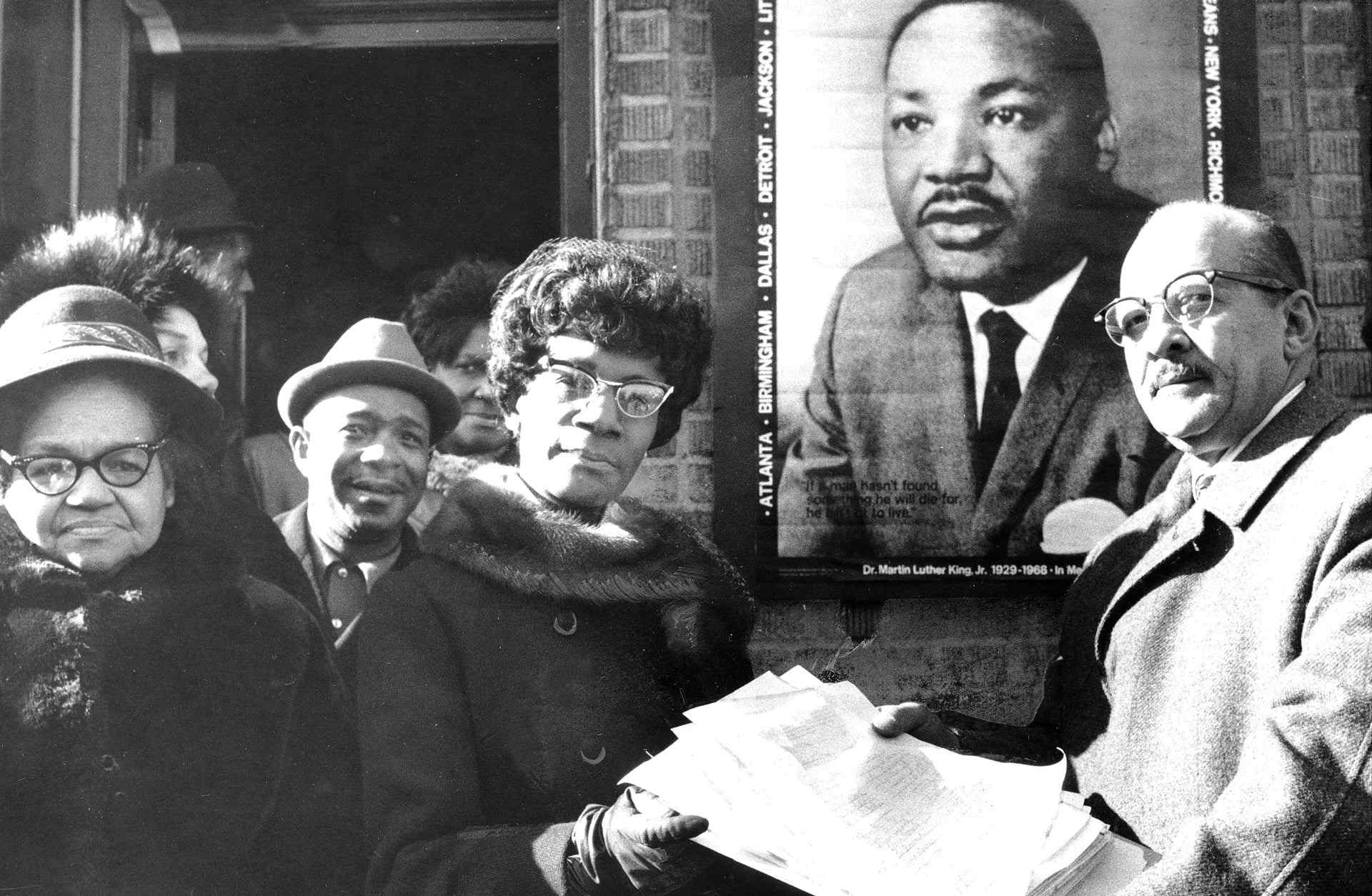 Rep. Shirley Chisholm receives petitions asking Congress to designate January 15, a national holiday in honor of Martin Luther King, Jr.