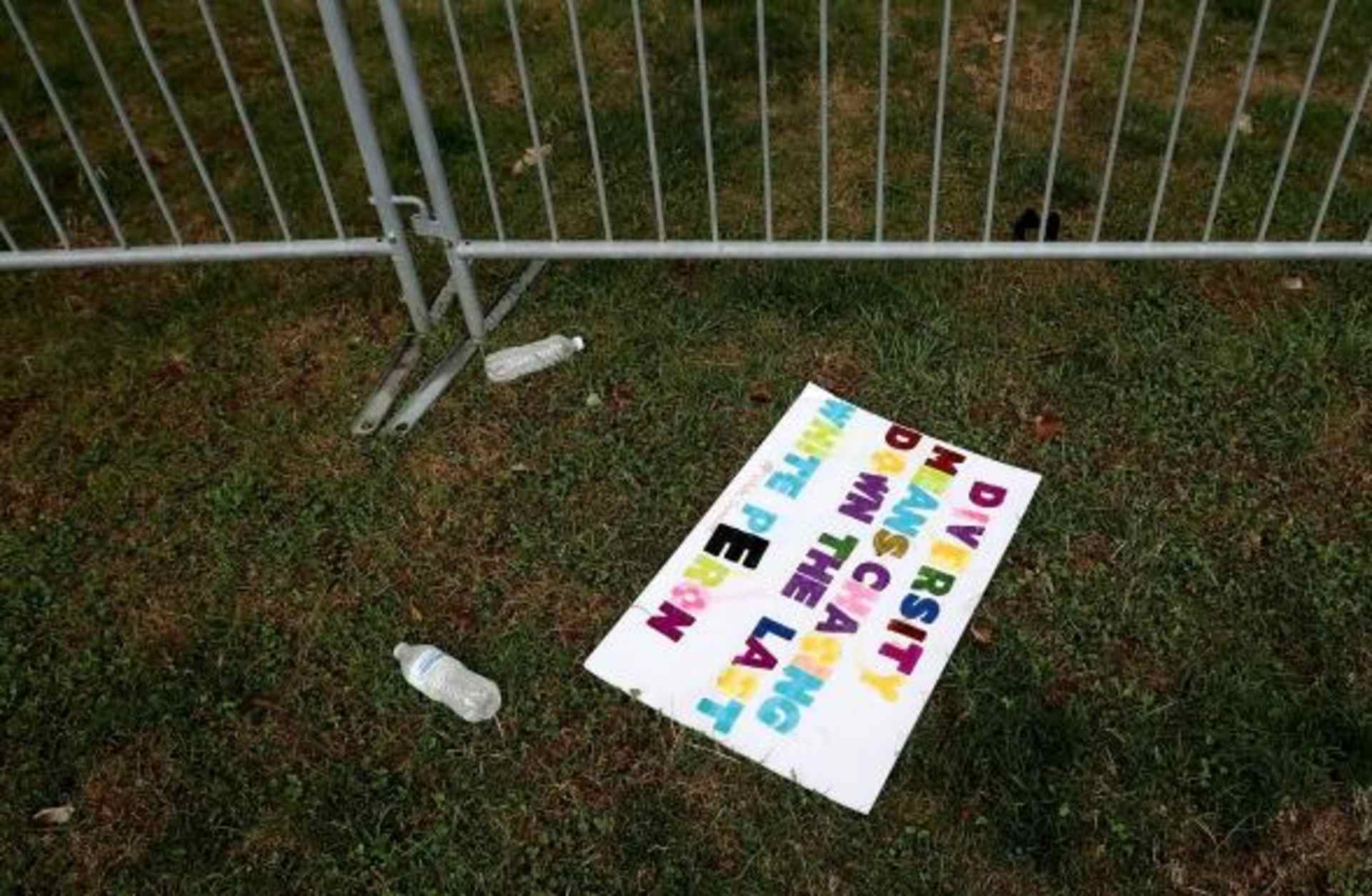 Signs left behind by white nationalists, neo-Nazis, the Ku Klux Klan and members of the 'alt-right' the day after the Unite the Right rally devolved into violence August 13, 2017 in Charlottesville, Virginia. The Charlottesville City Council voted to remove the statue and change the name of the space from Lee Park to Emancipation Park, sparking protests from racist groups. (Credit: Chip Somodevilla/Getty Images)