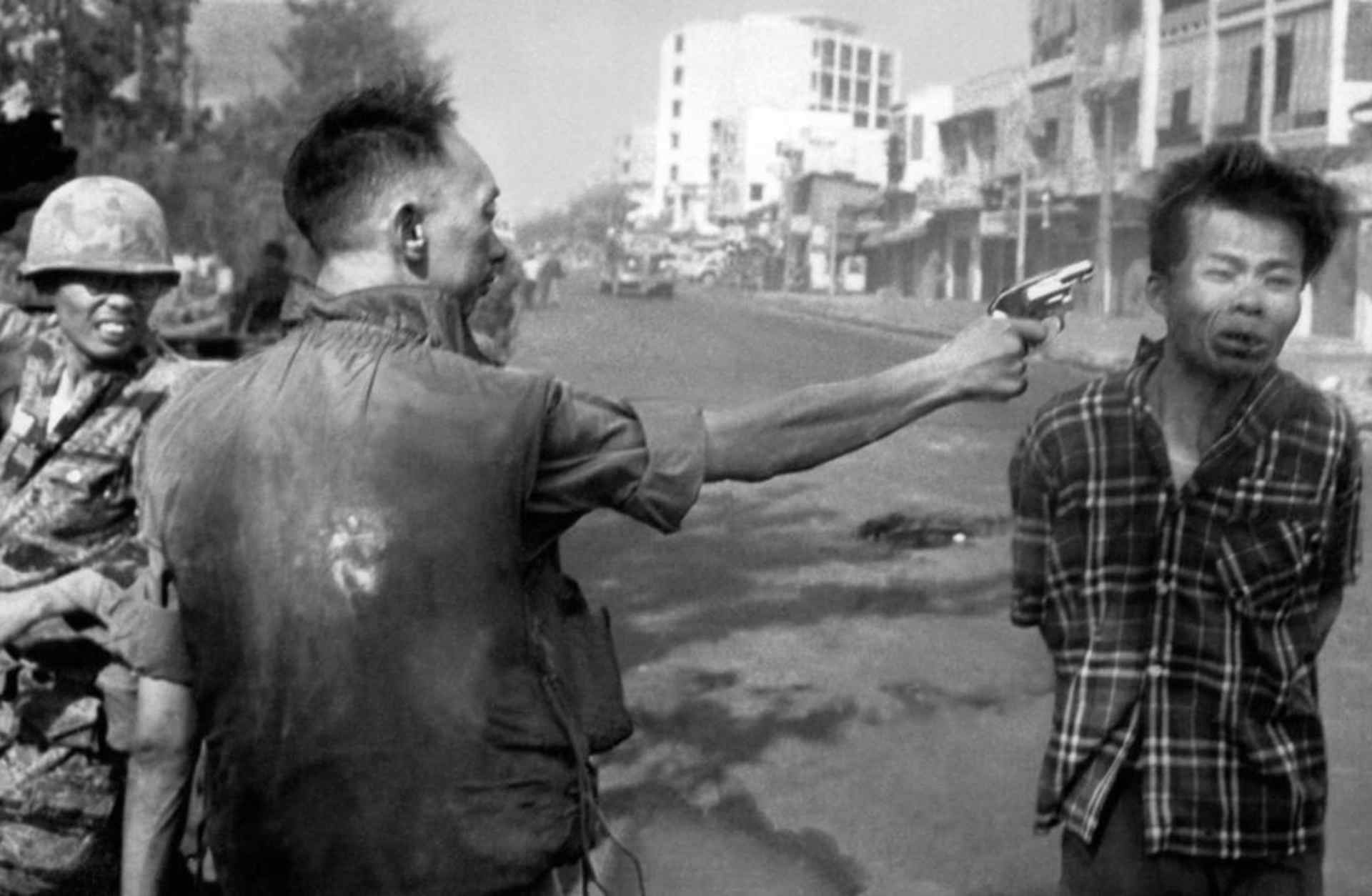 South Vietnamese Gen. Nguyen Ngoc Loan, chief of the national police, fires his pistol, shoots, executes into the head of suspected Viet Cong officer Nguyen Van Lem (also known as Bay Lop) on a Saigon street Feb. 1, 1968, early in the Tet Offensive.